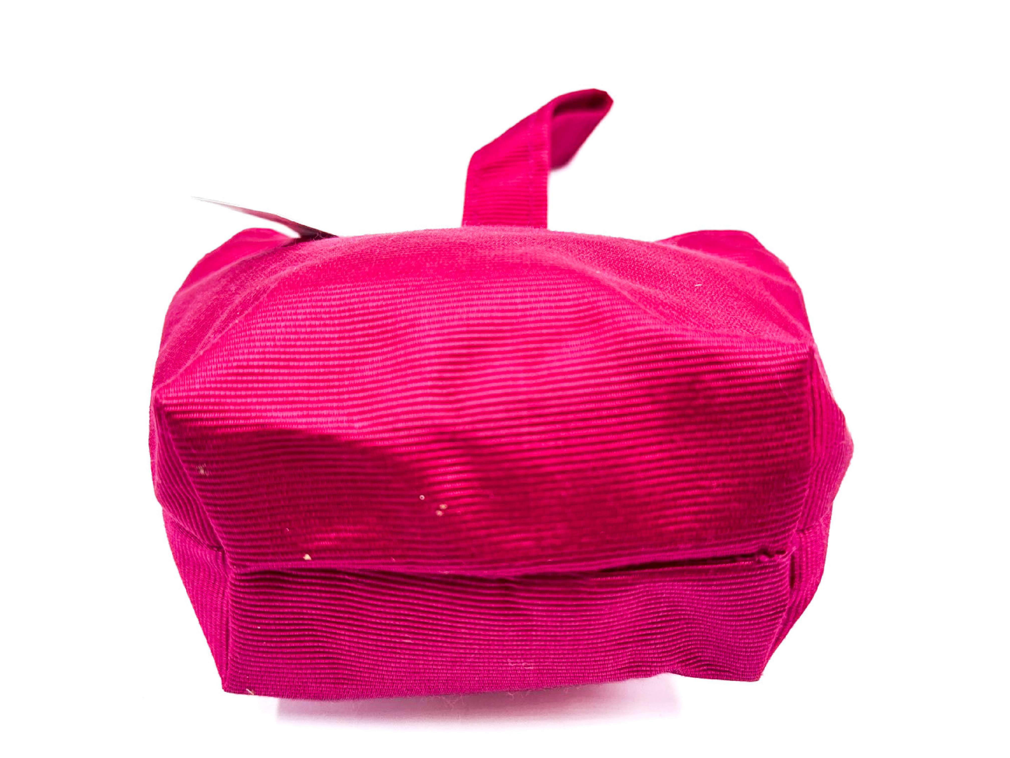 pink handbag with circle clasp and gold hardware, with tags. — view 7