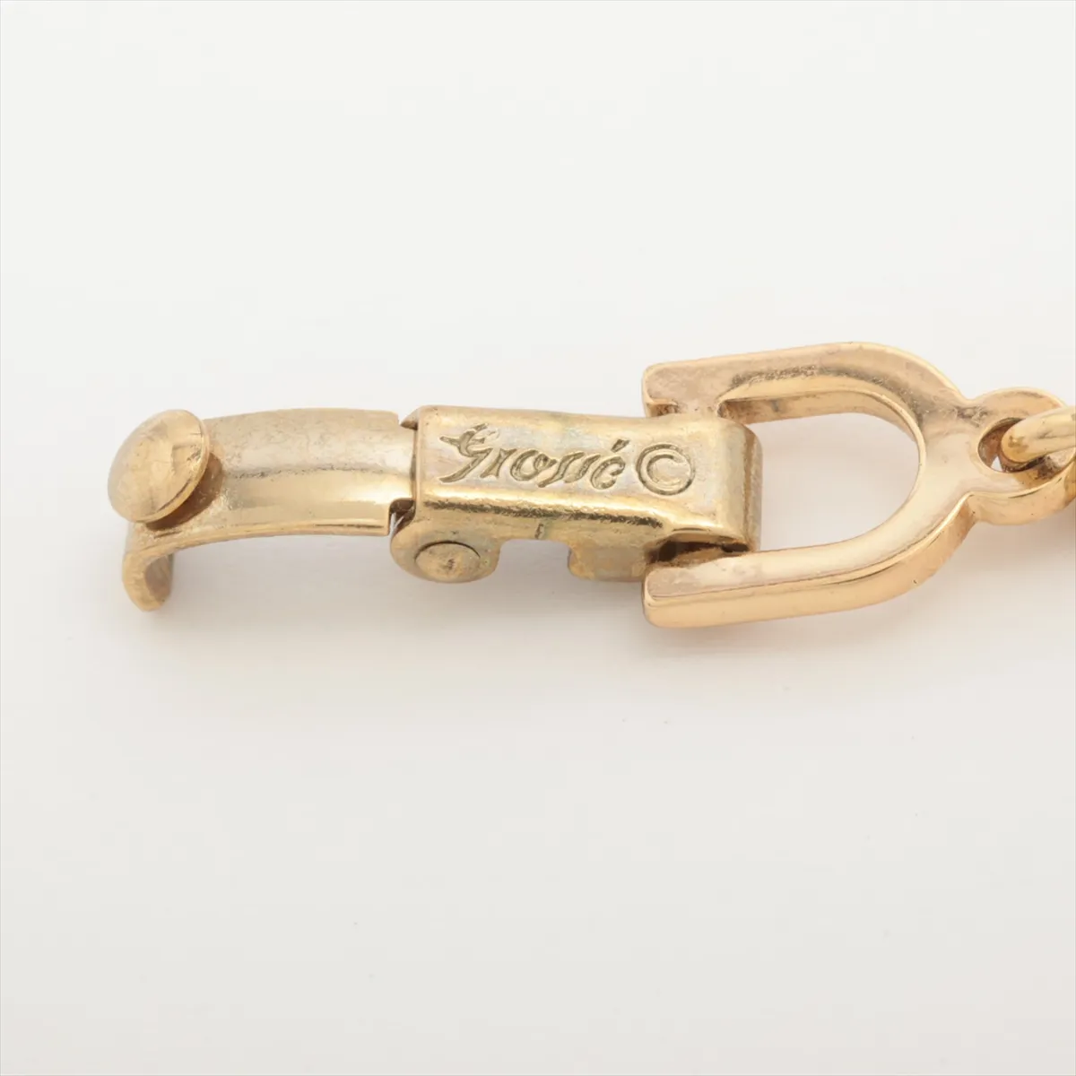CD logo bracelet, gold plated with rhinestones. Shows signs of wear including — view 5