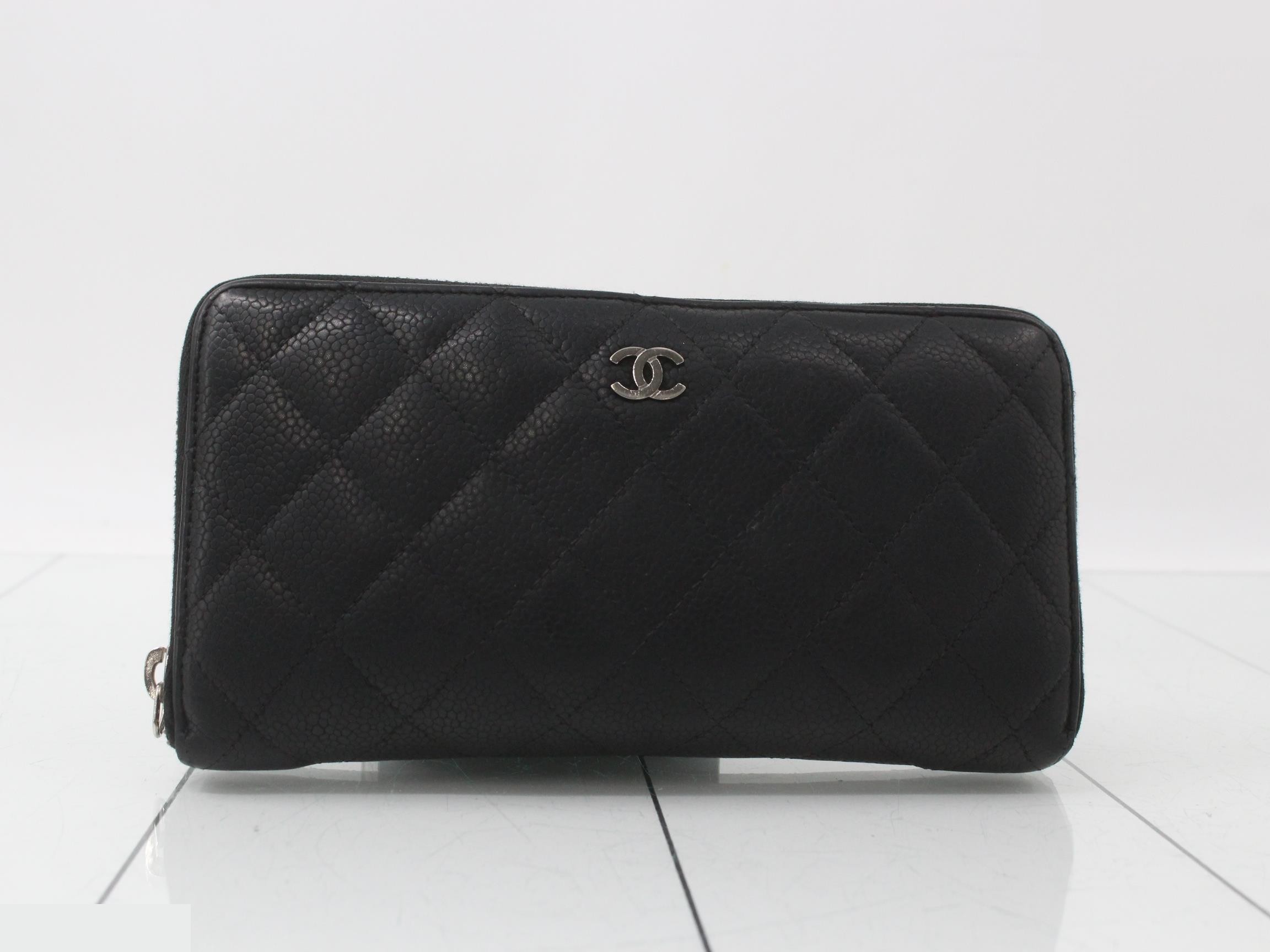 caviar leather wallet with Coco Mark, round zipper closure.