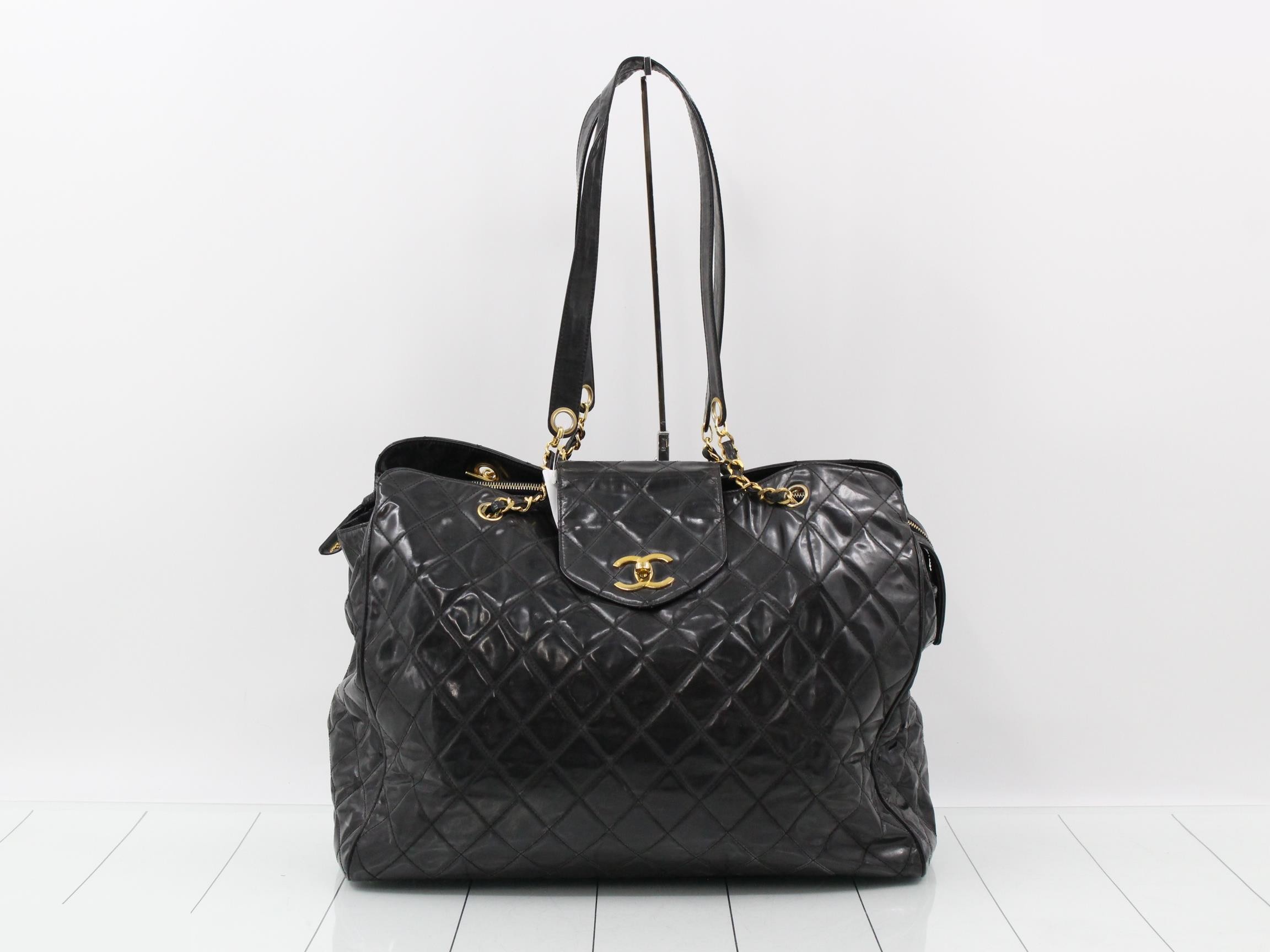 Supermodel patent leather chain tote bag, black and gold.