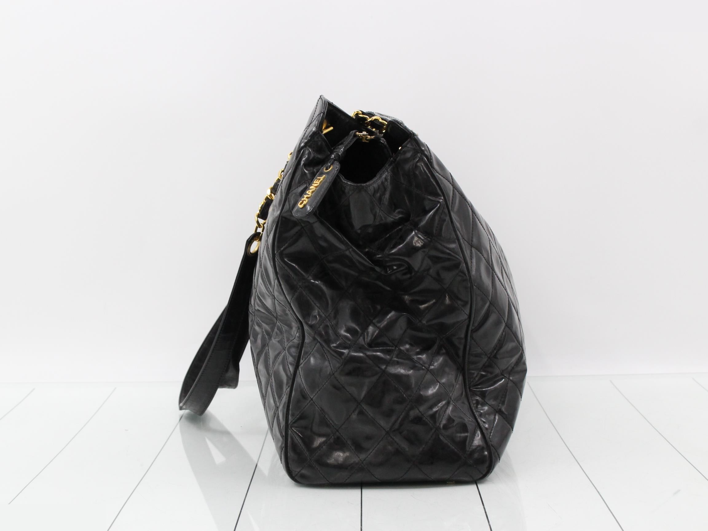 Supermodel patent leather chain tote bag, black and gold. — view 4