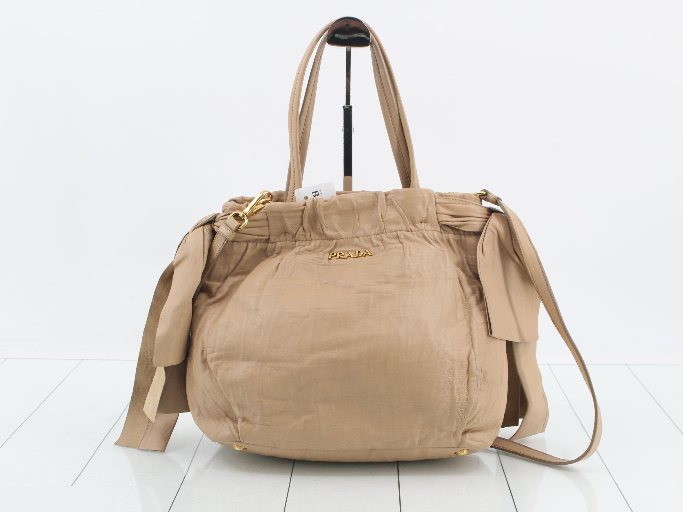 Leather tote bag, beige, gold hardware, shoulder strap and card holder included.