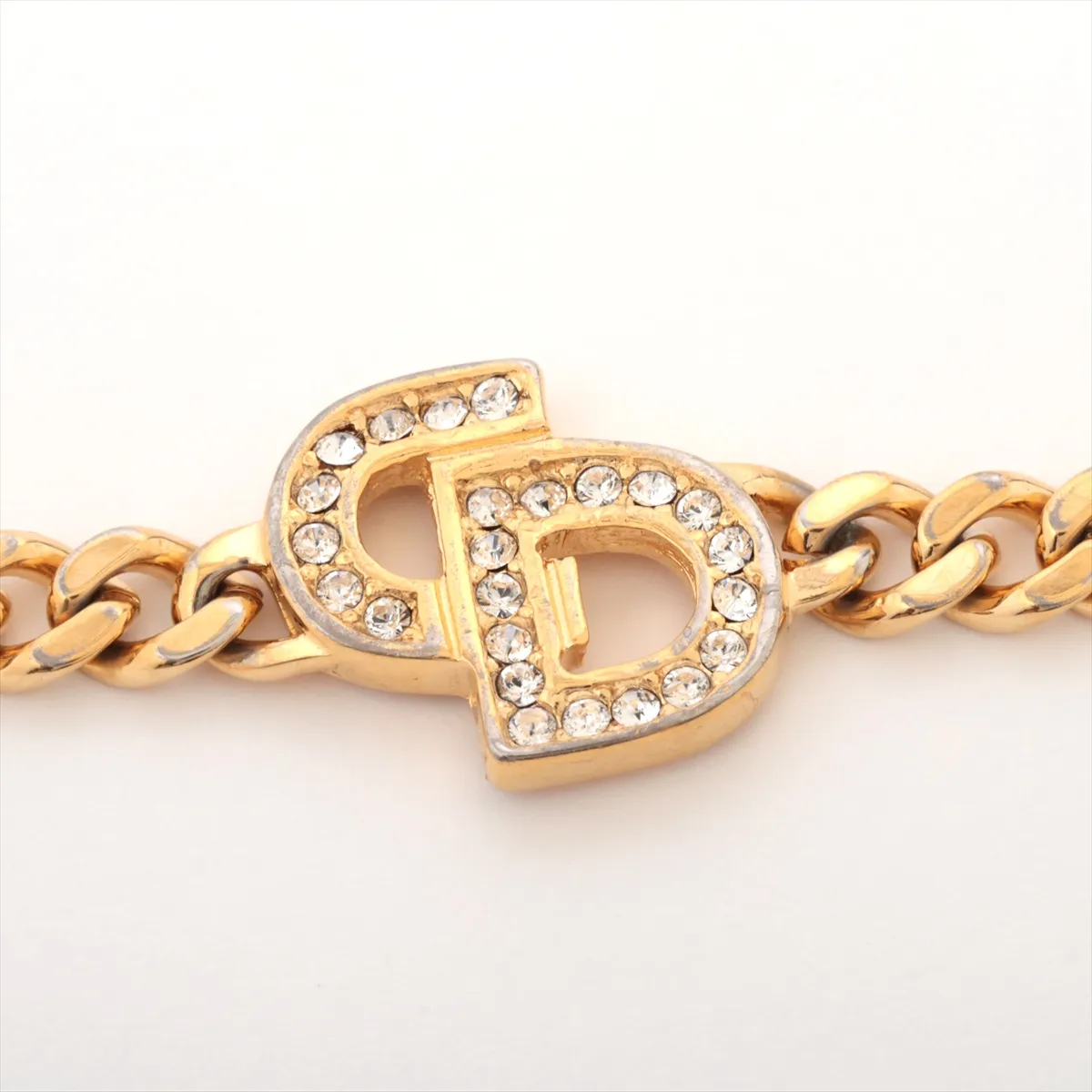 CD logo bracelet, gold plated with rhinestones. Shows signs of wear, including — view 2