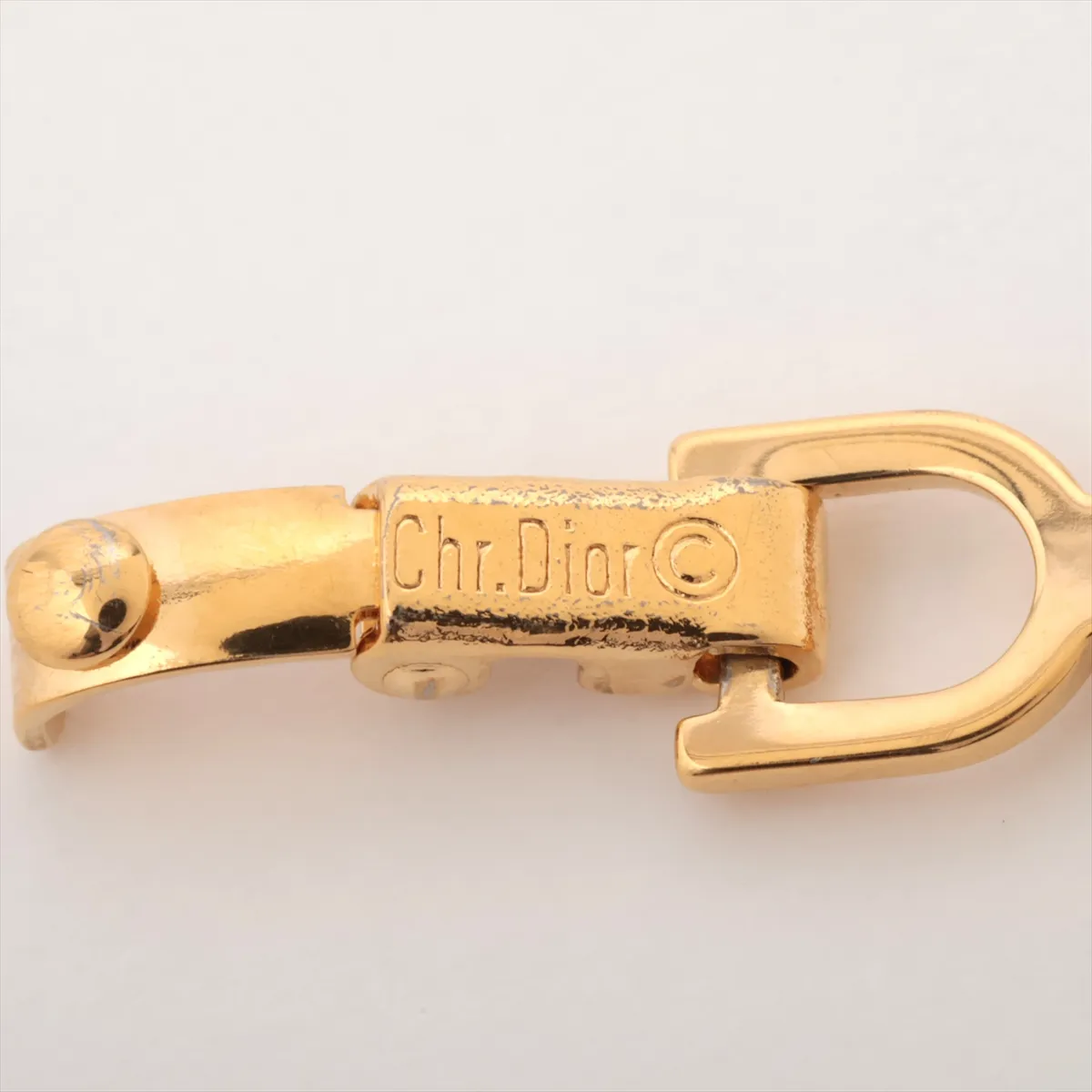 CD logo bracelet, gold plated with rhinestones. Shows signs of wear, including — view 5