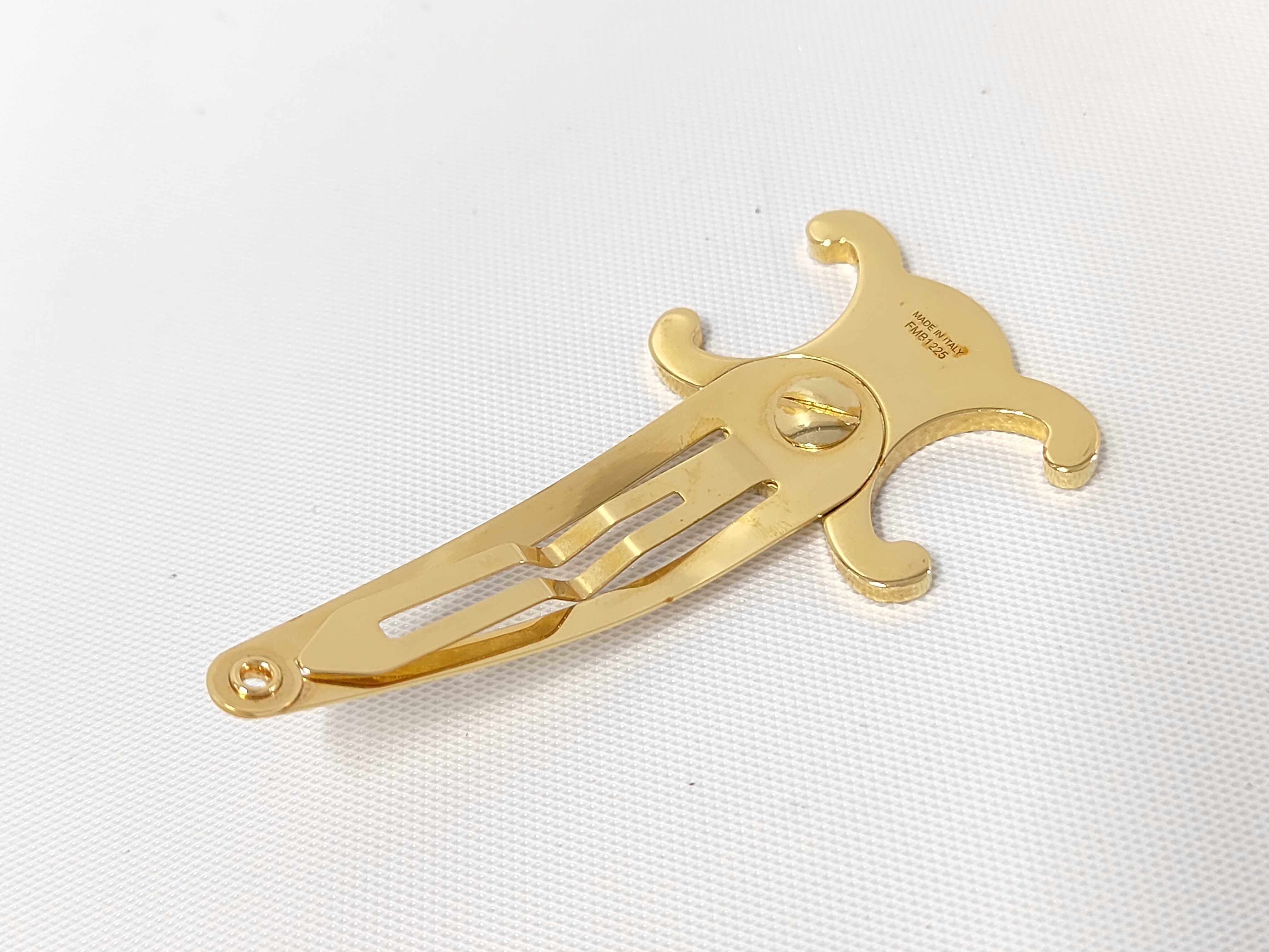 Triomphe Hair Clip. Includes: Box, dust bag, and hair accessory. — view 2