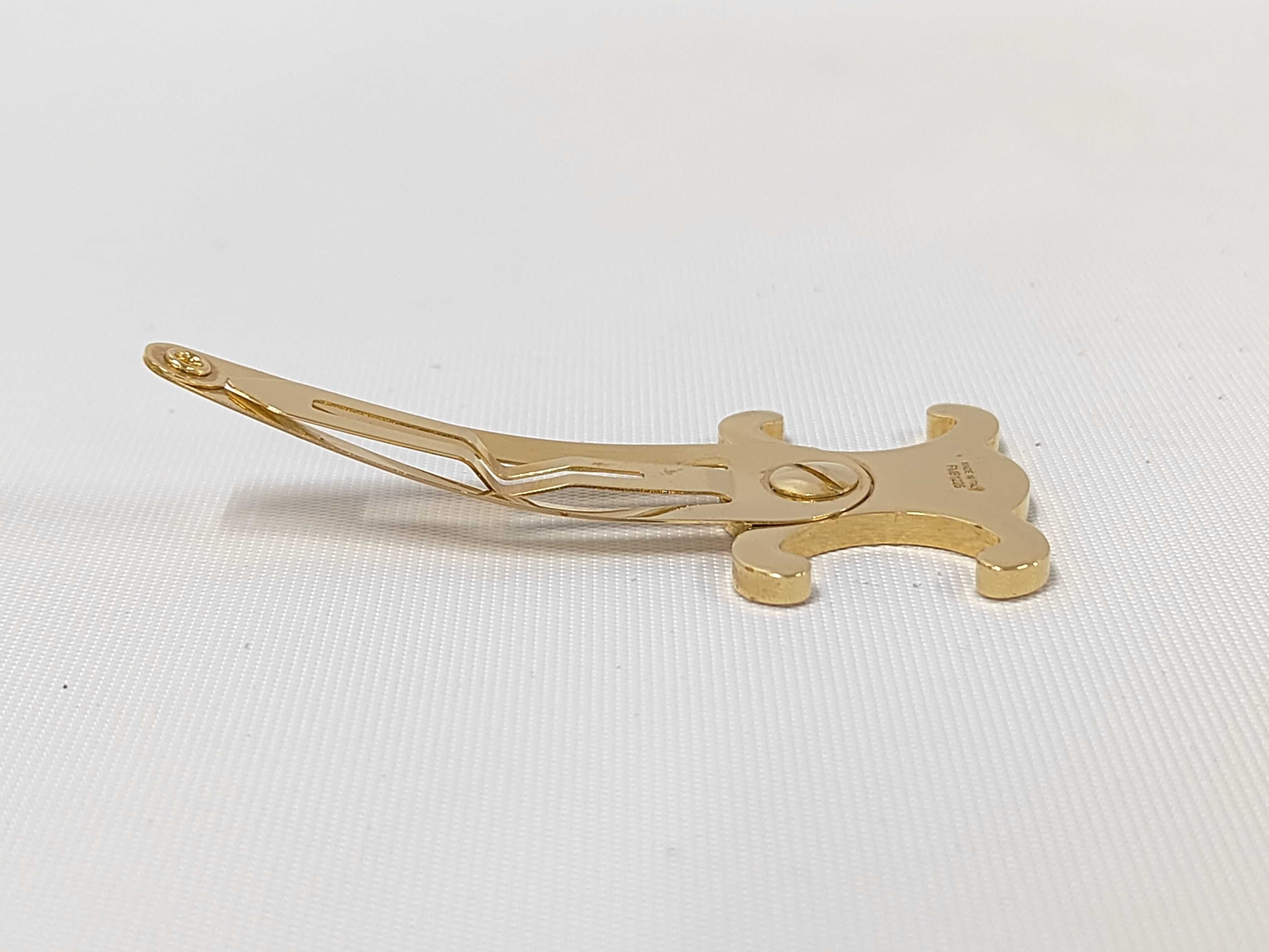 Triomphe Hair Clip. Includes: Box, dust bag, and hair accessory. — view 3