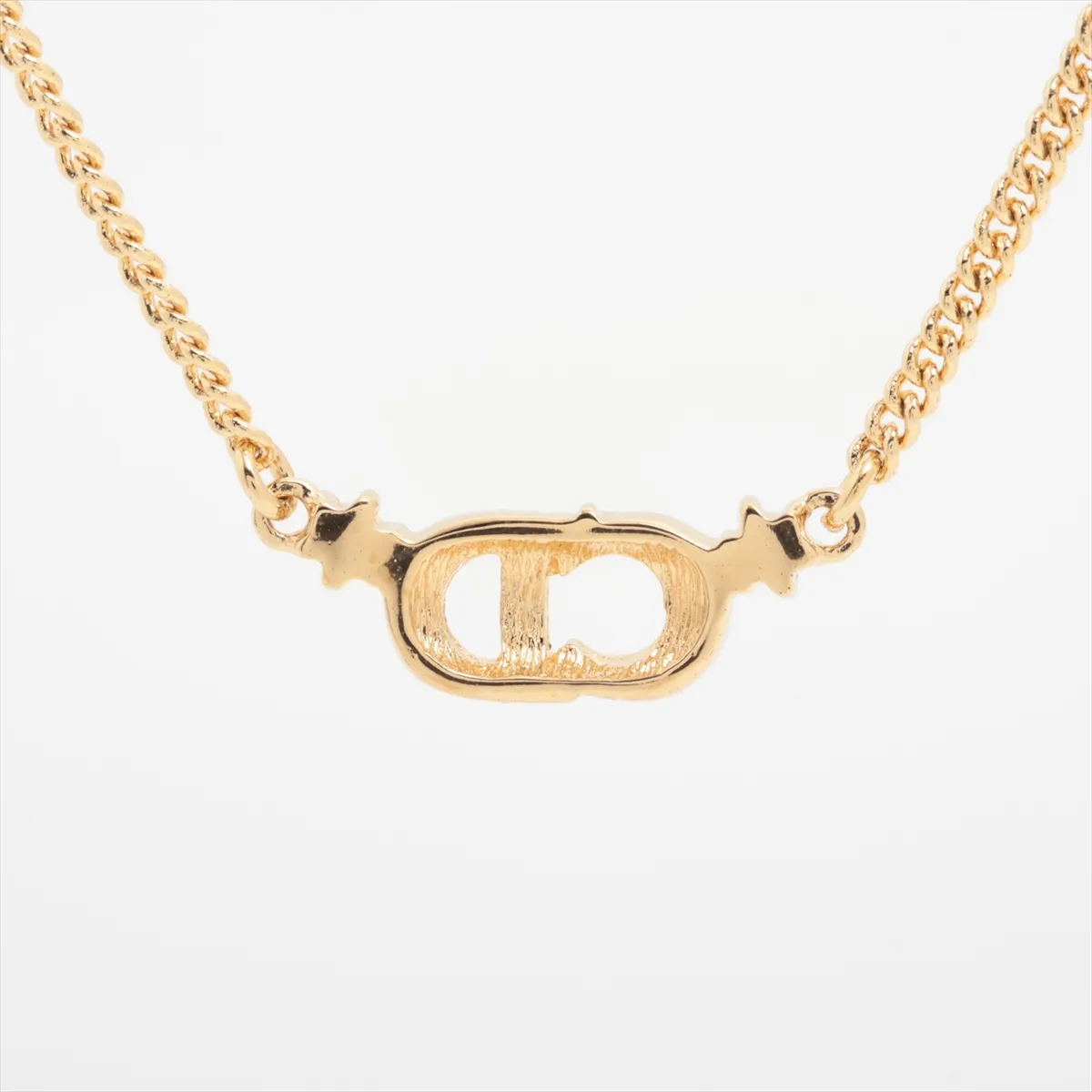 CD logo necklace, gold plated with rhinestones. Shows signs of wear, — view 2