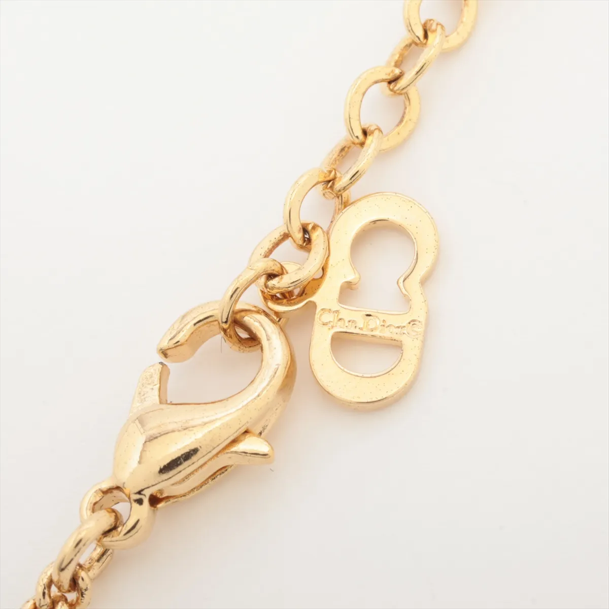 CD logo necklace, gold plated with rhinestones. Shows signs of wear, — view 4