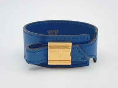 Artemis bracelet, gold and blue, approximately 27cm in length.