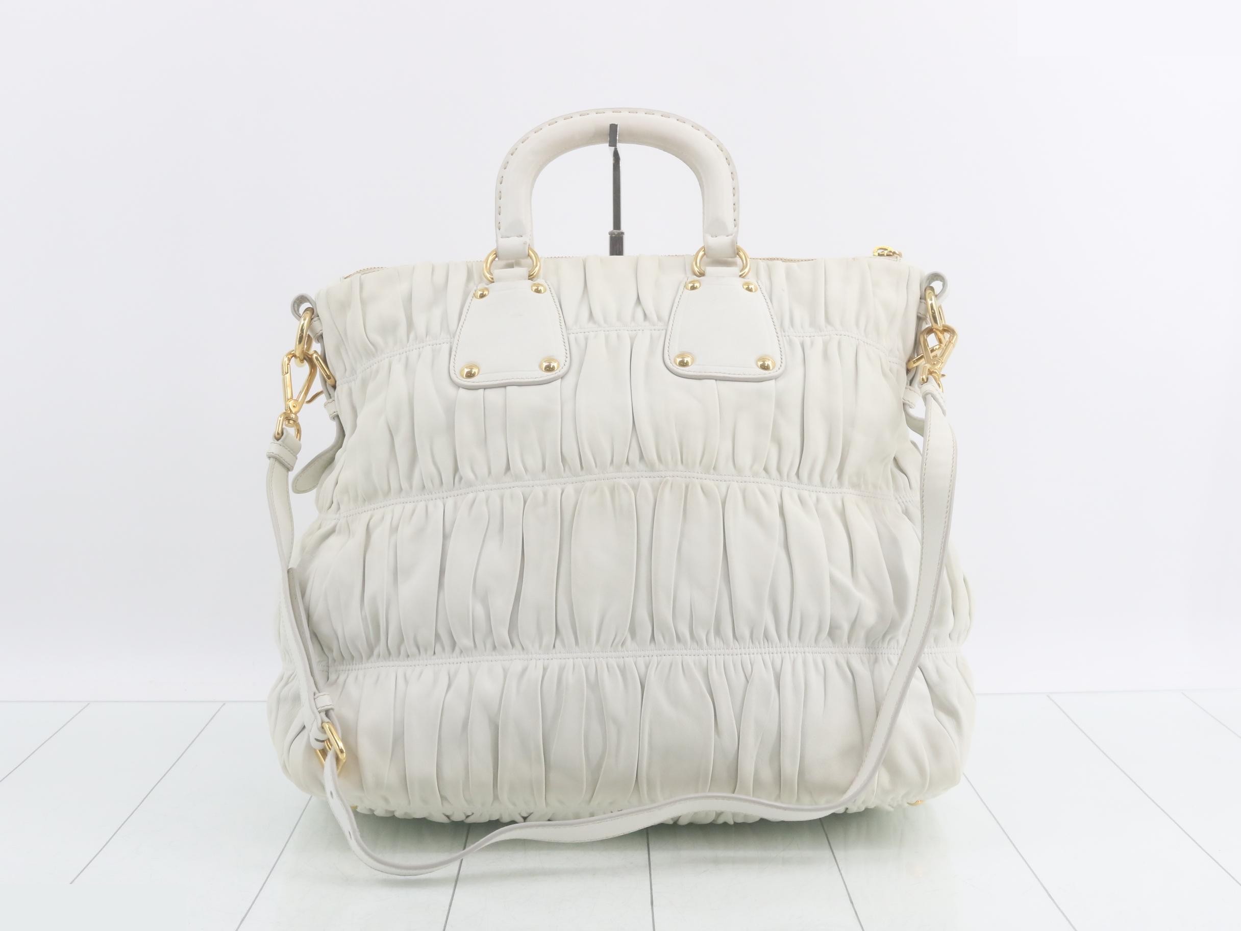 Leather 2-way gathered handbag with shoulder strap and dust bag. — view 2