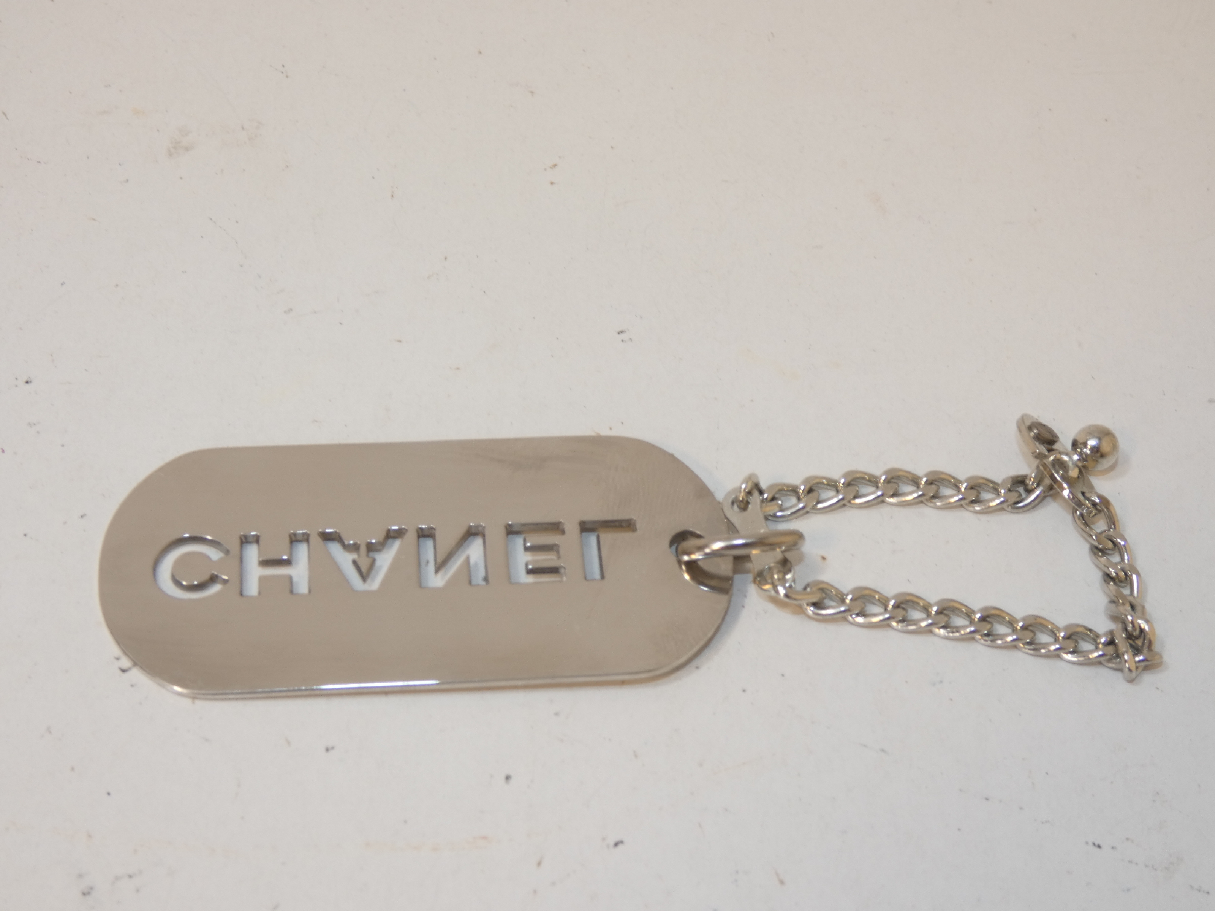 logo punched silver keychain charm — view 2