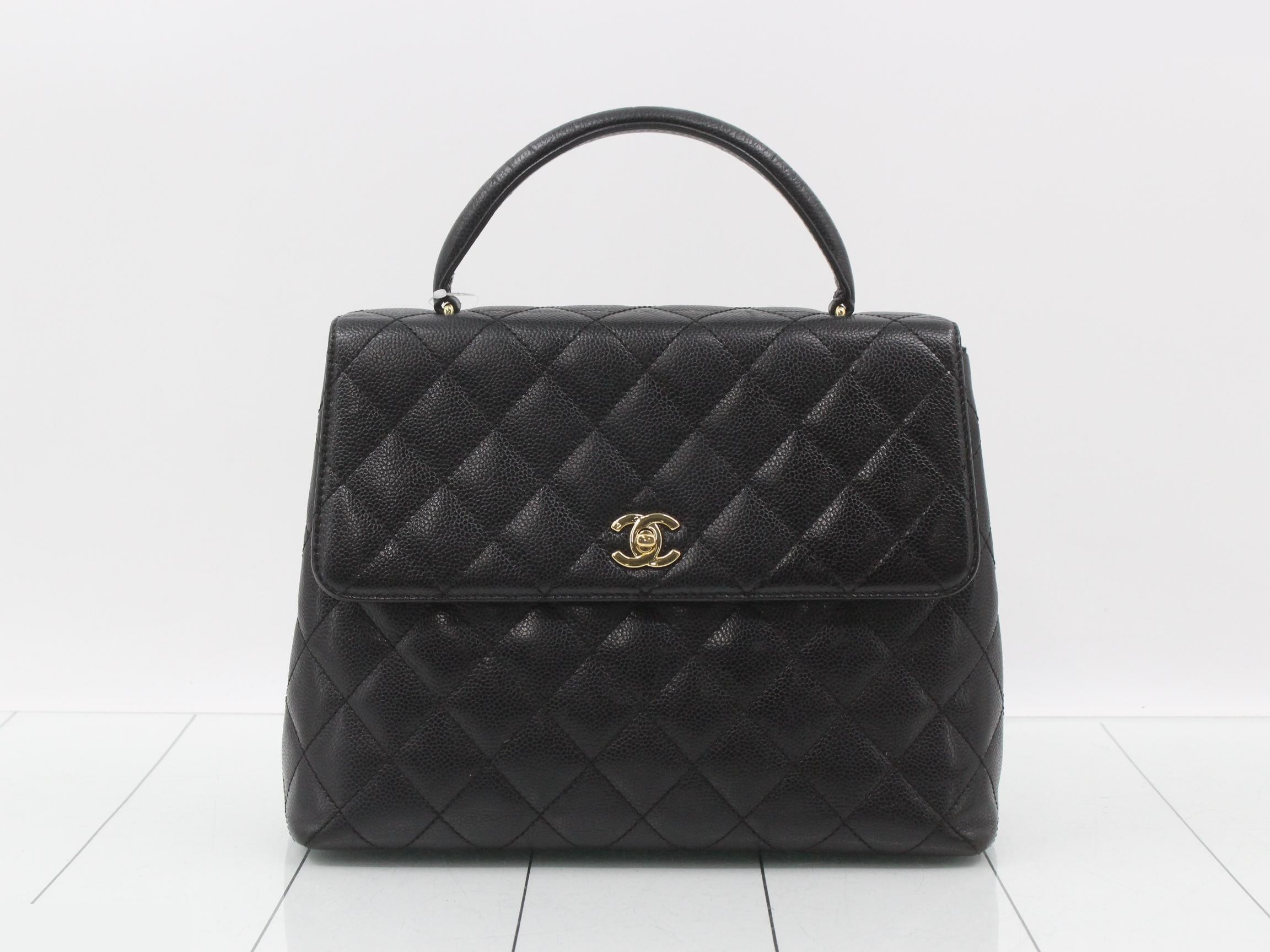 Kelly-style handbag, black, with original seal.