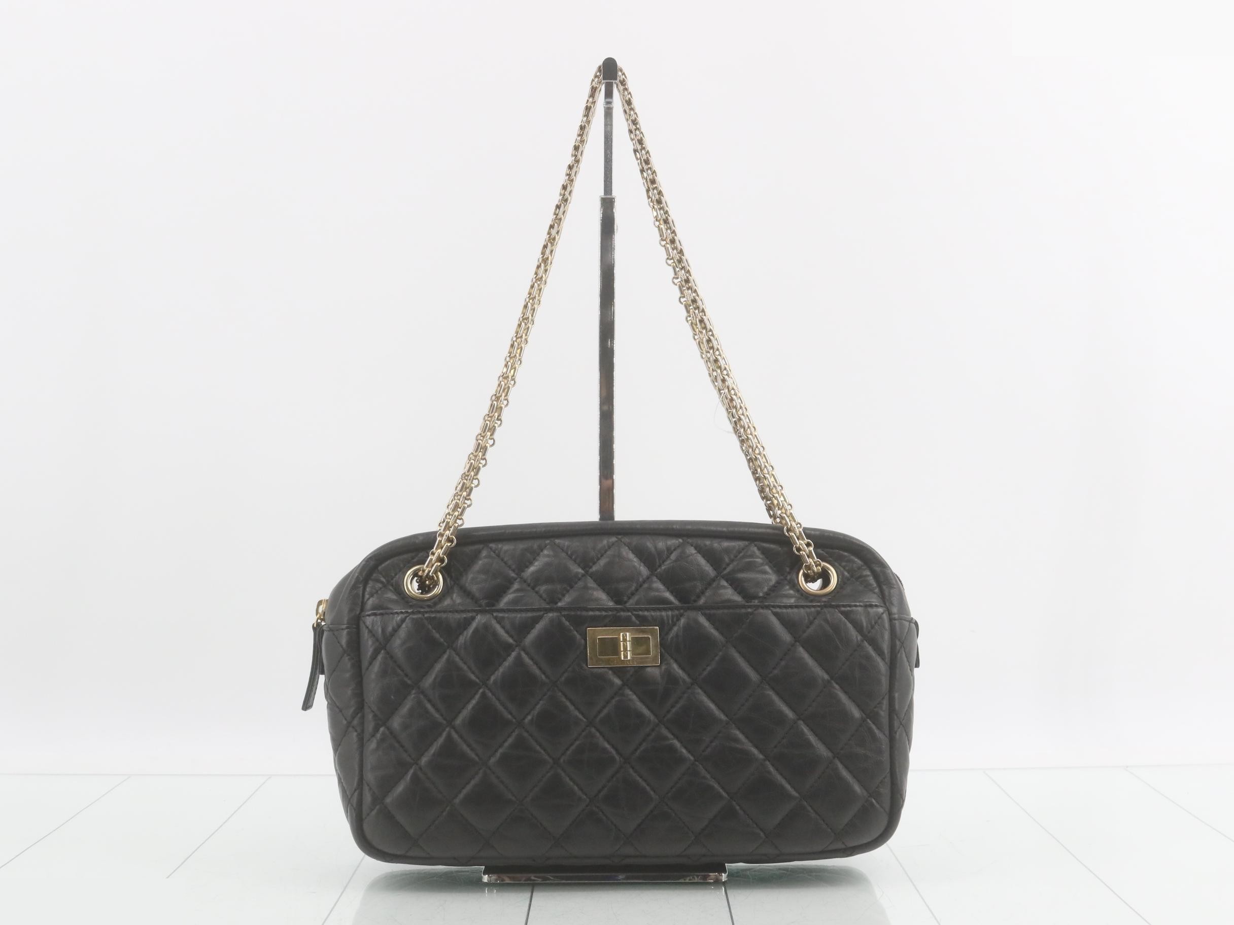 2.55 Shoulder bag, black, gold hardware, with protective seal.