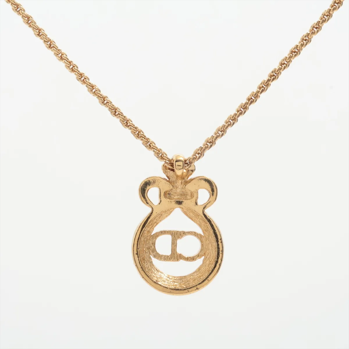 CD logo necklace, gold plated with rhinestones. Shows signs of wear, tarnishing, — view 2
