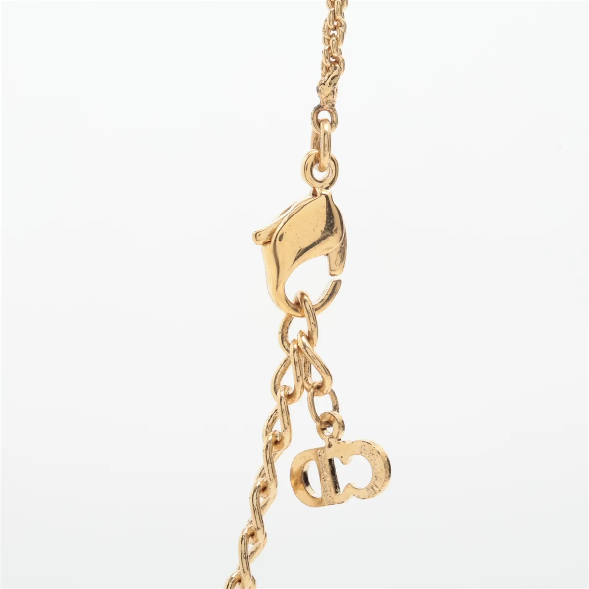 CD logo necklace, gold plated with rhinestones. Shows signs of wear, tarnishing, — view 3