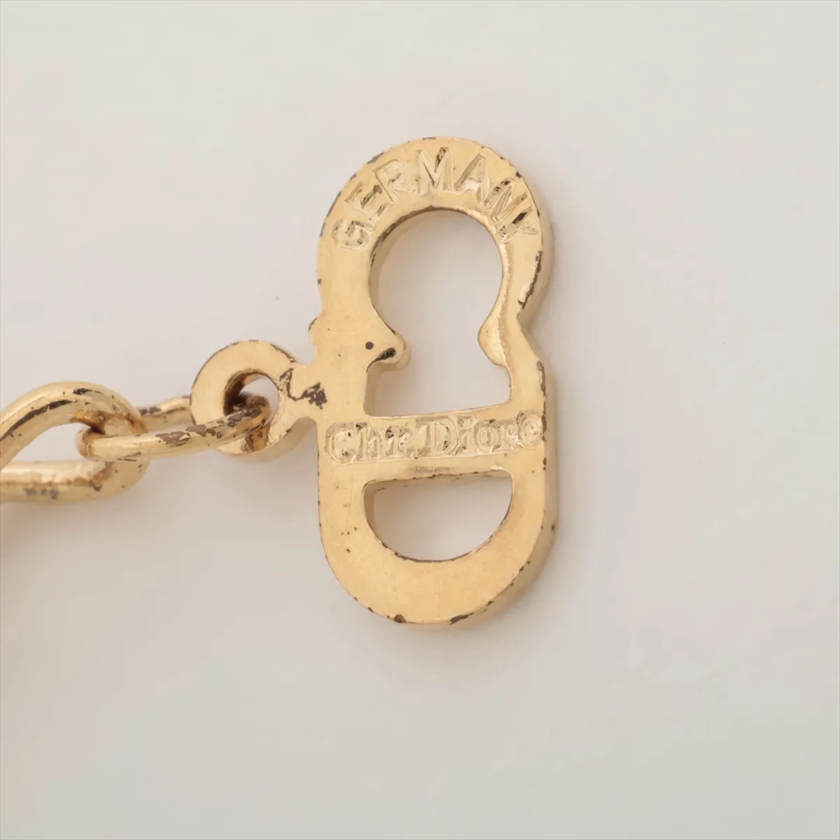 CD logo necklace, gold plated with rhinestones. Shows signs of wear, tarnishing, — view 4
