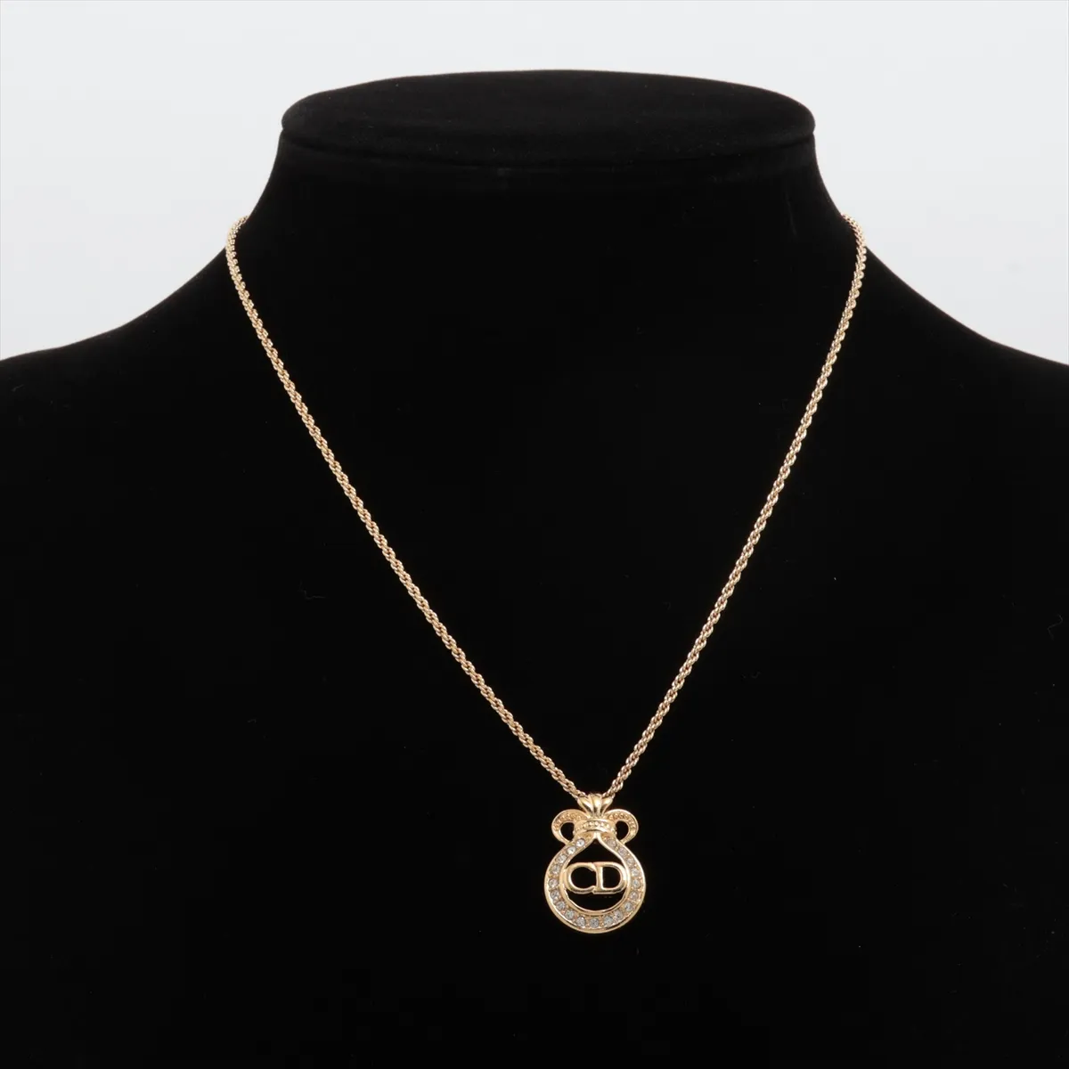 CD logo necklace, gold plated with rhinestones. Shows signs of wear, tarnishing, — view 5