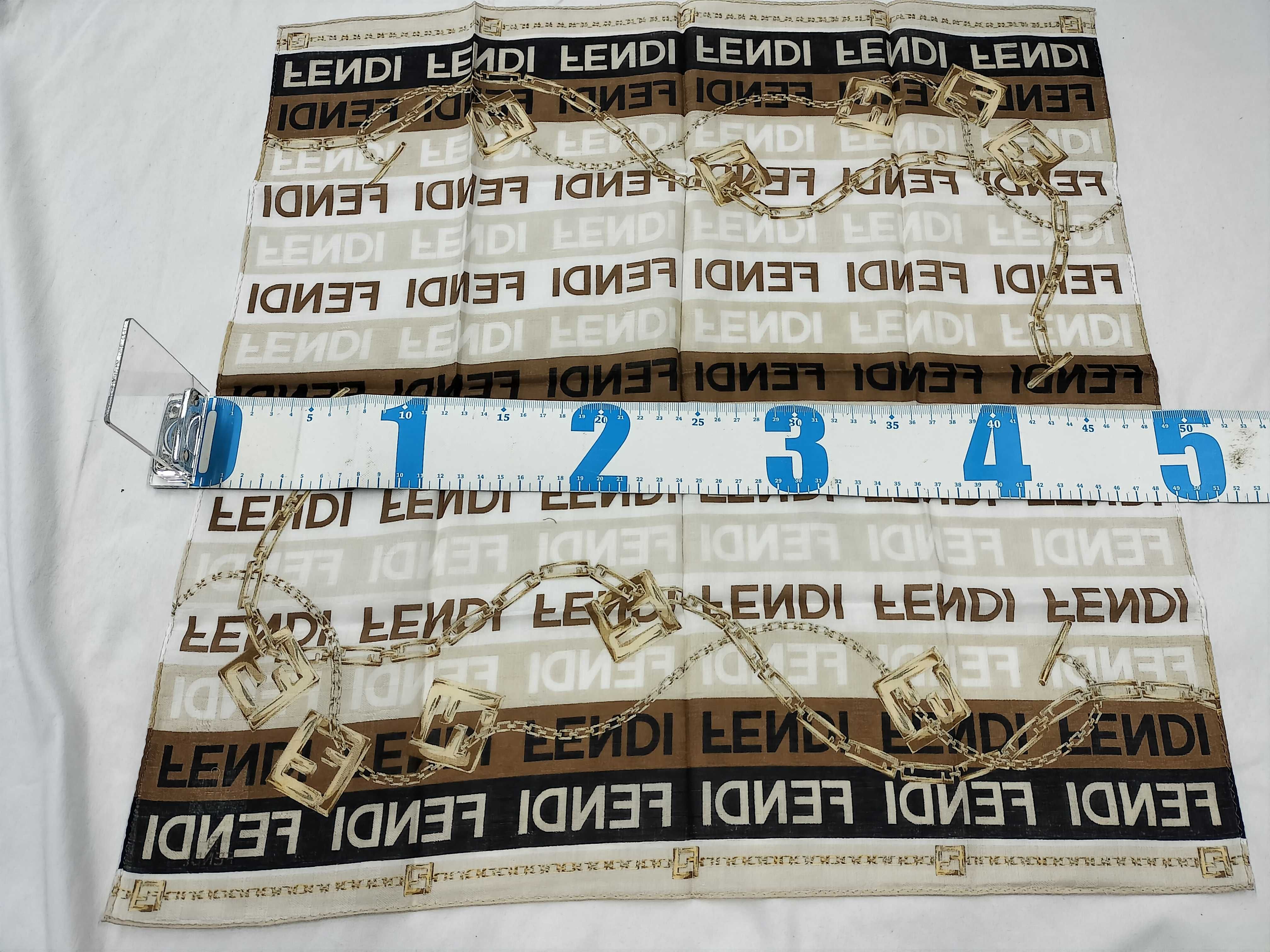 Zucca pattern Fendi handkerchief scarf with sticker, all-over logo print FF Zucca chain, and other accessories. — view 2