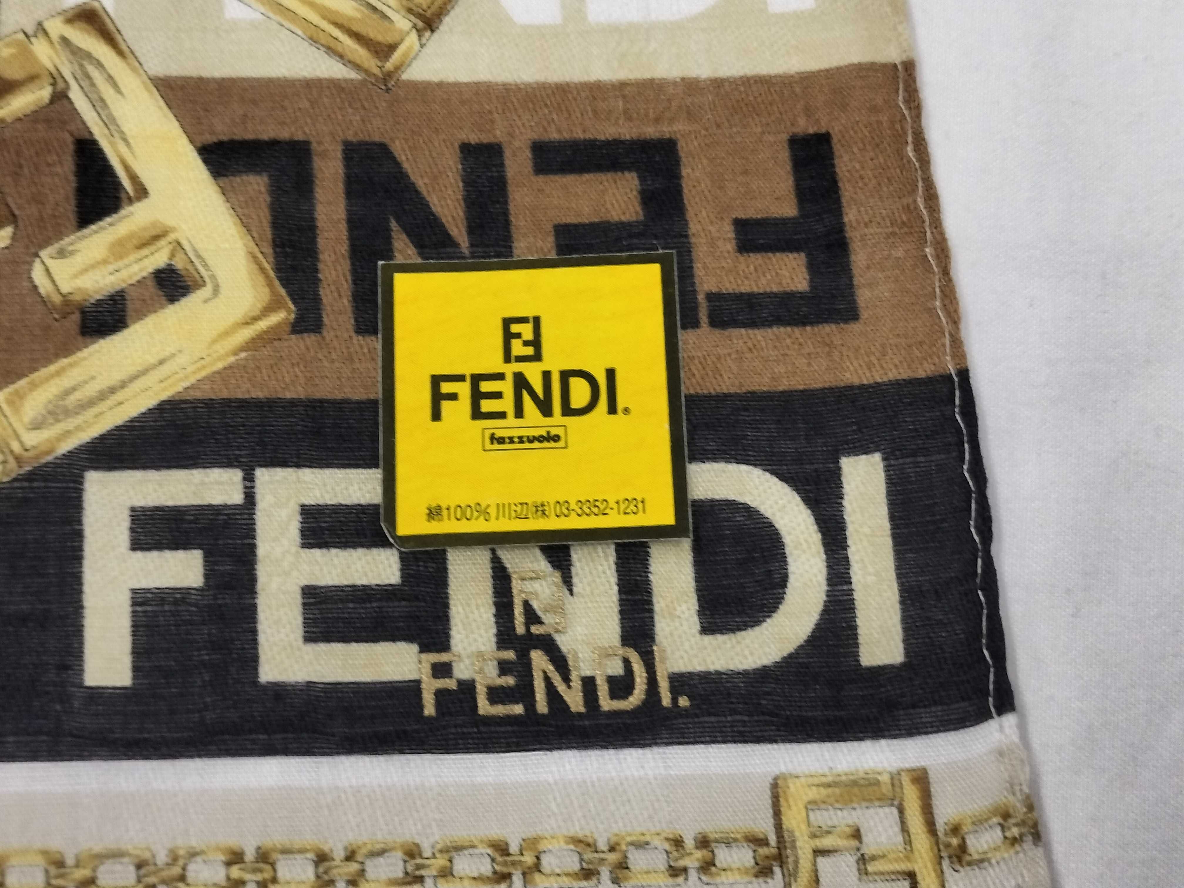 Zucca pattern Fendi handkerchief scarf with sticker, all-over logo print FF Zucca chain, and other accessories. — view 3