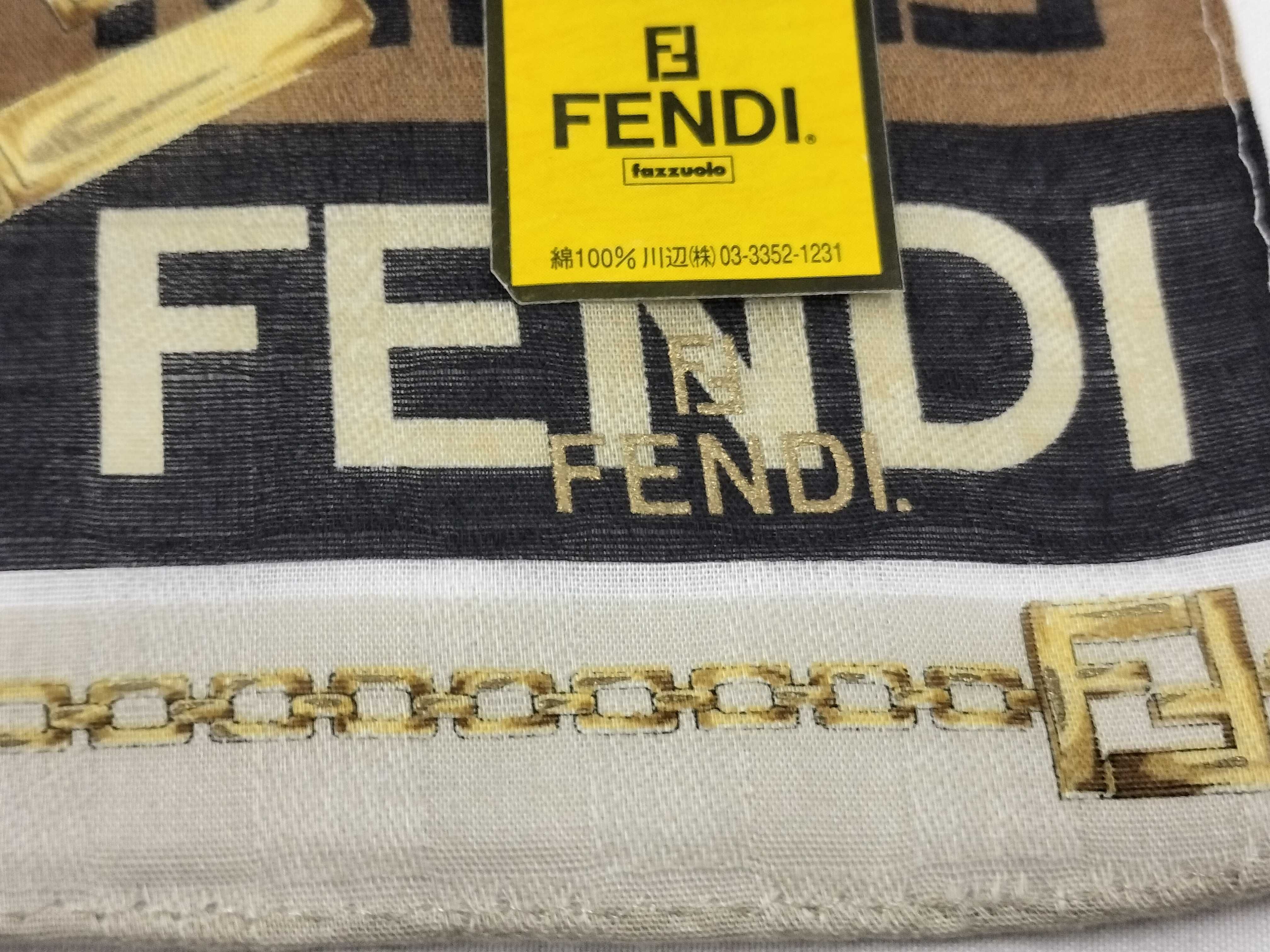 Zucca pattern Fendi handkerchief scarf with sticker, all-over logo print FF Zucca chain, and other accessories. — view 4