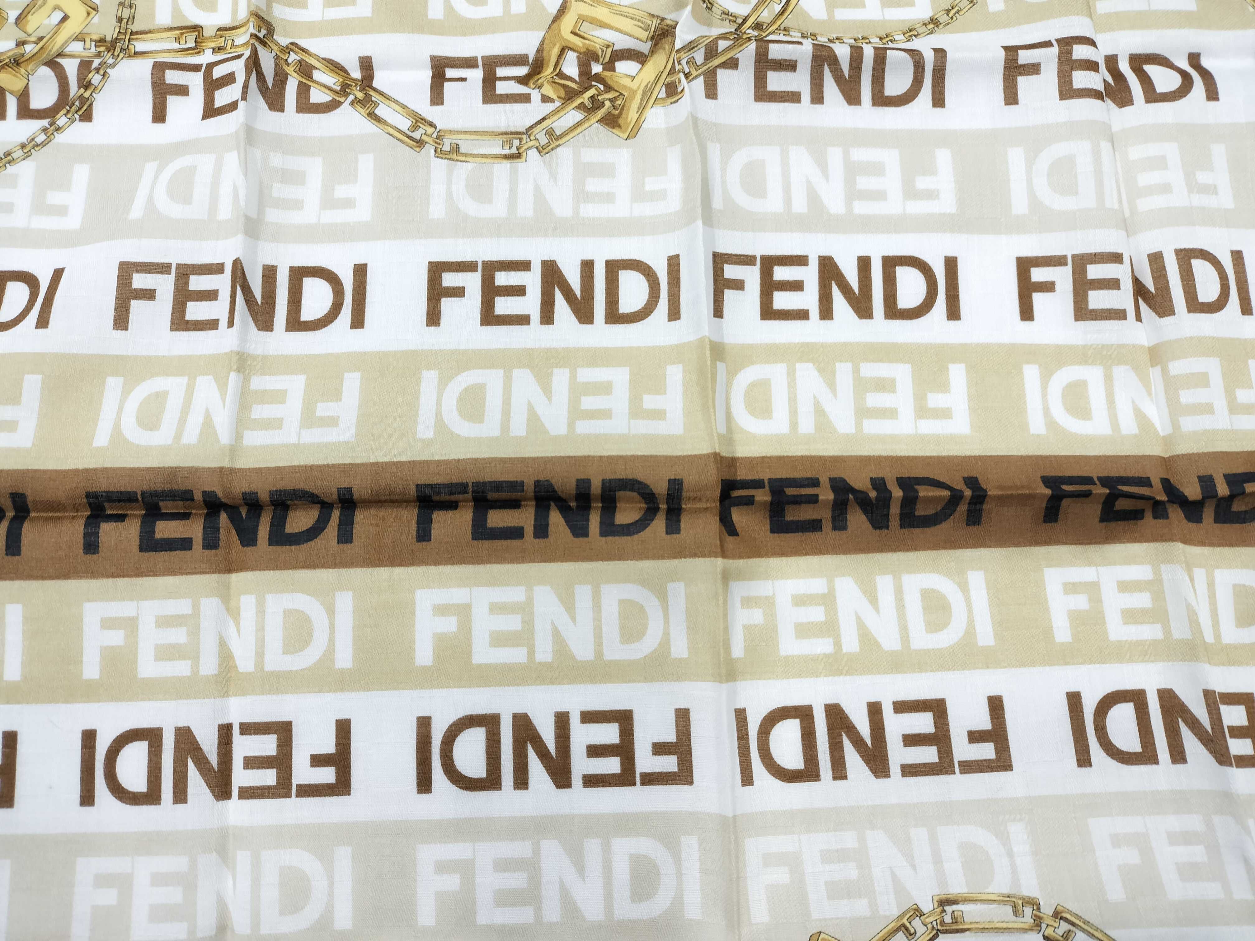 Zucca pattern Fendi handkerchief scarf with sticker, all-over logo print FF Zucca chain, and other accessories. — view 6