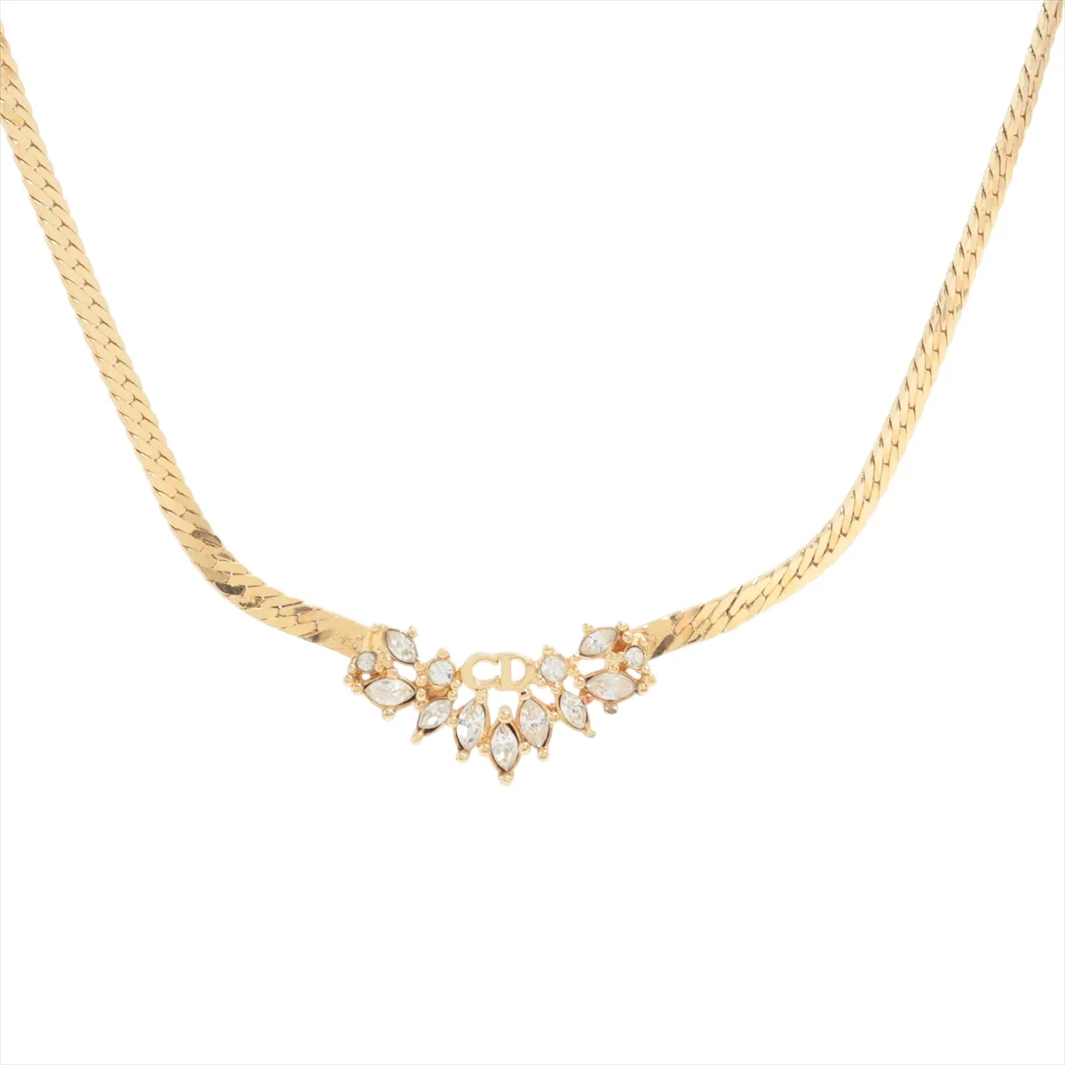 CD logo necklace, gold plated with rhinestones. Shows signs of wear,