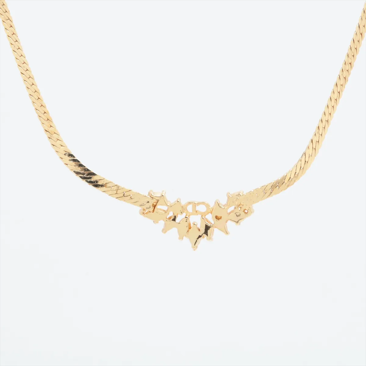 CD logo necklace, gold plated with rhinestones. Shows signs of wear, — view 2