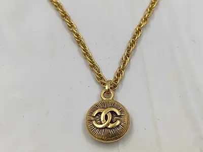 necklace with box, Sunburst design.