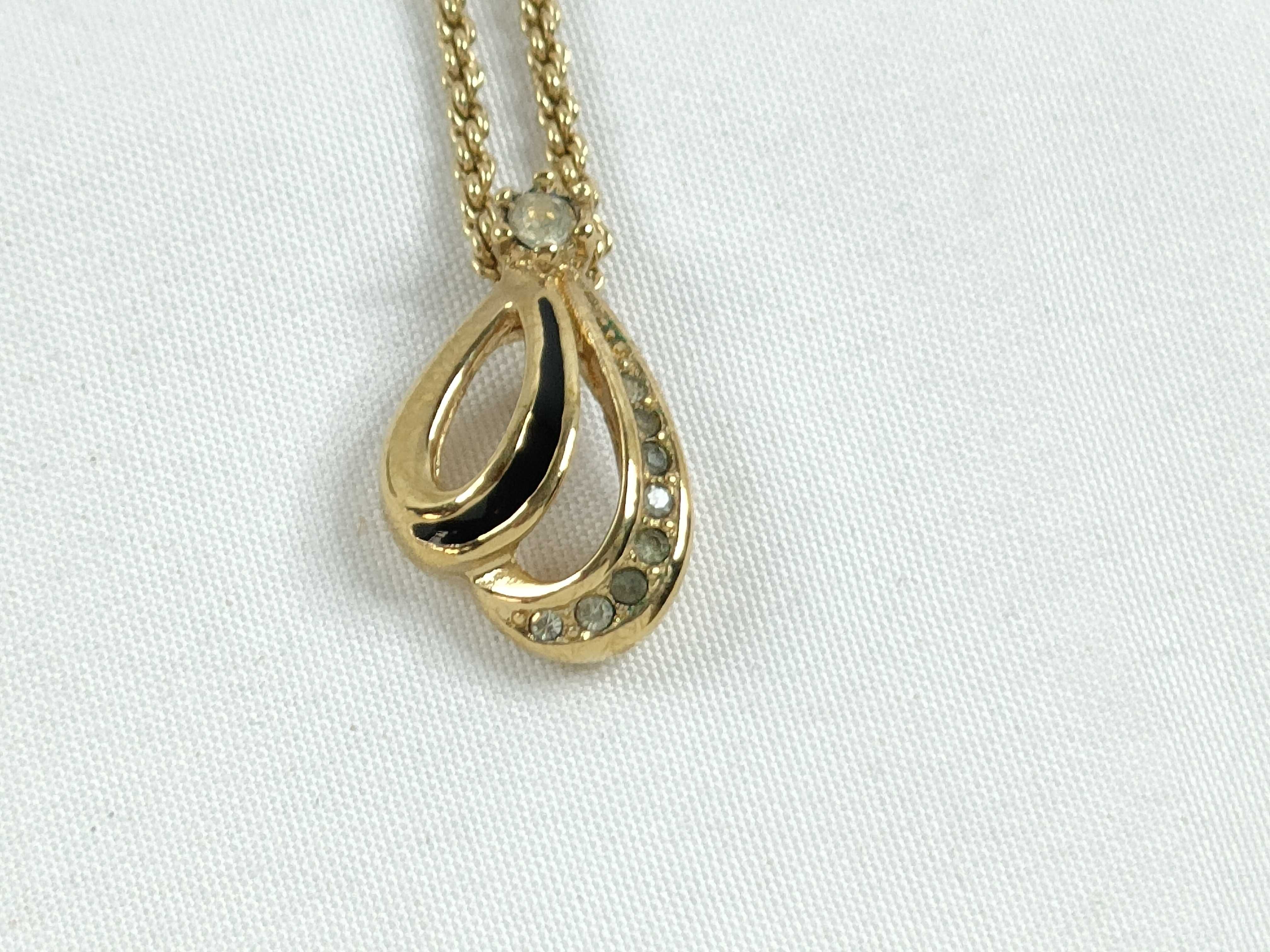 Christian necklace with rhinestones, black and gold.