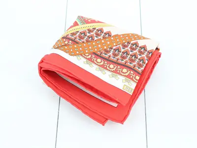 Unused, stored item: Carre silk scarf with tags and paper case.