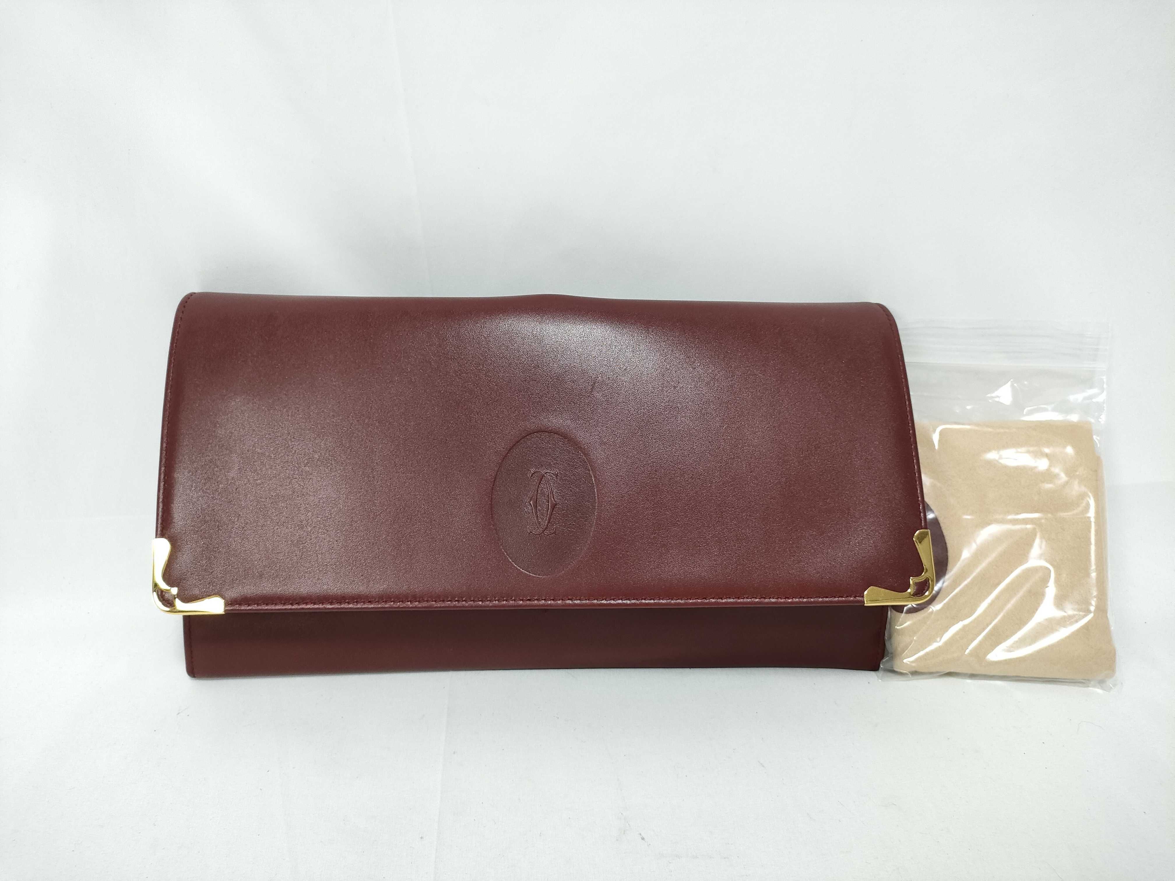 Must Line Clutch Bag, Bordeaux, with dust bag.