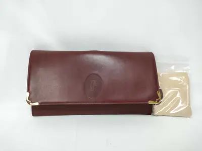 Must Line Clutch Bag, Bordeaux, with dust bag.