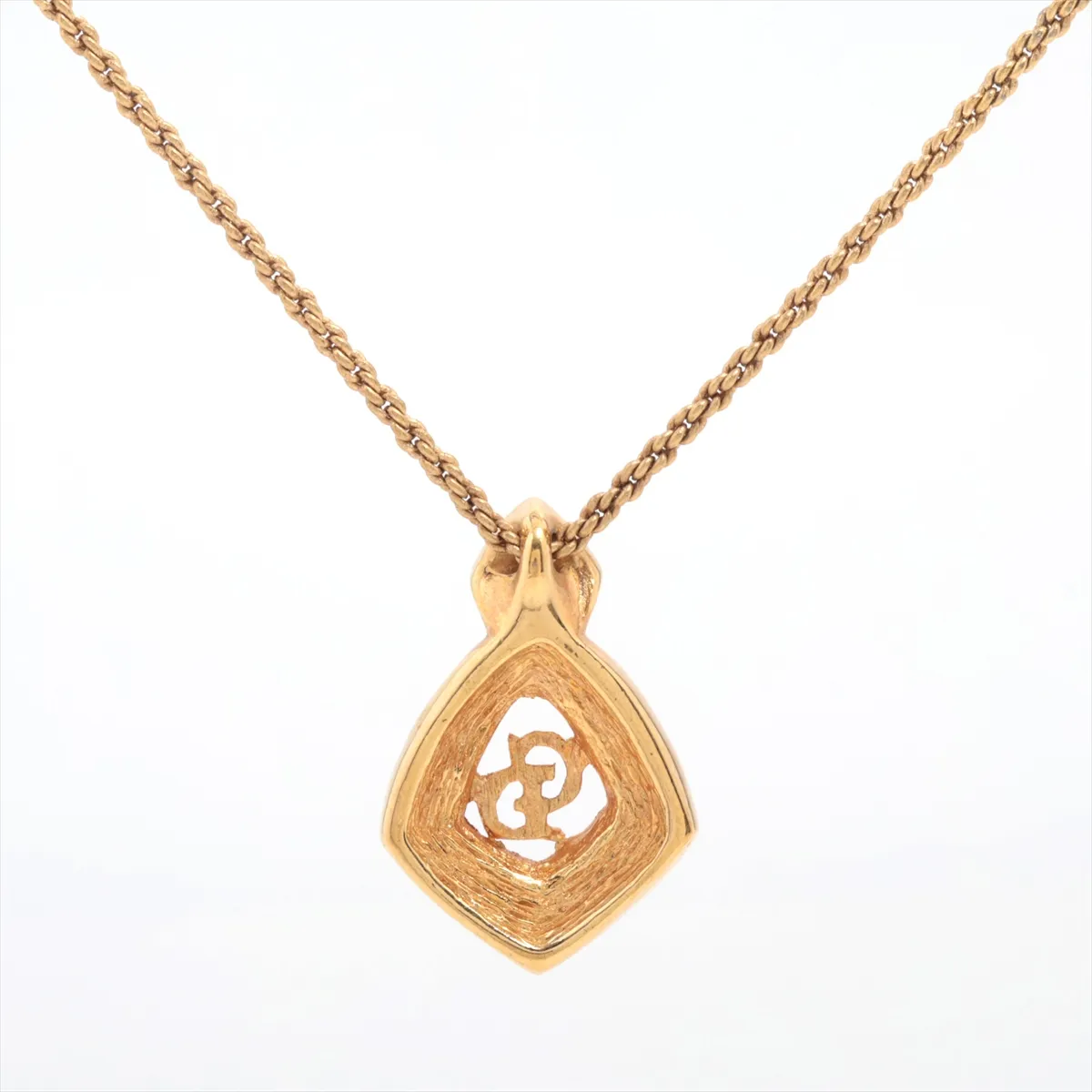 CD logo necklace, gold plated with rhinestones. Shows signs of wear, tarnishing, — view 2