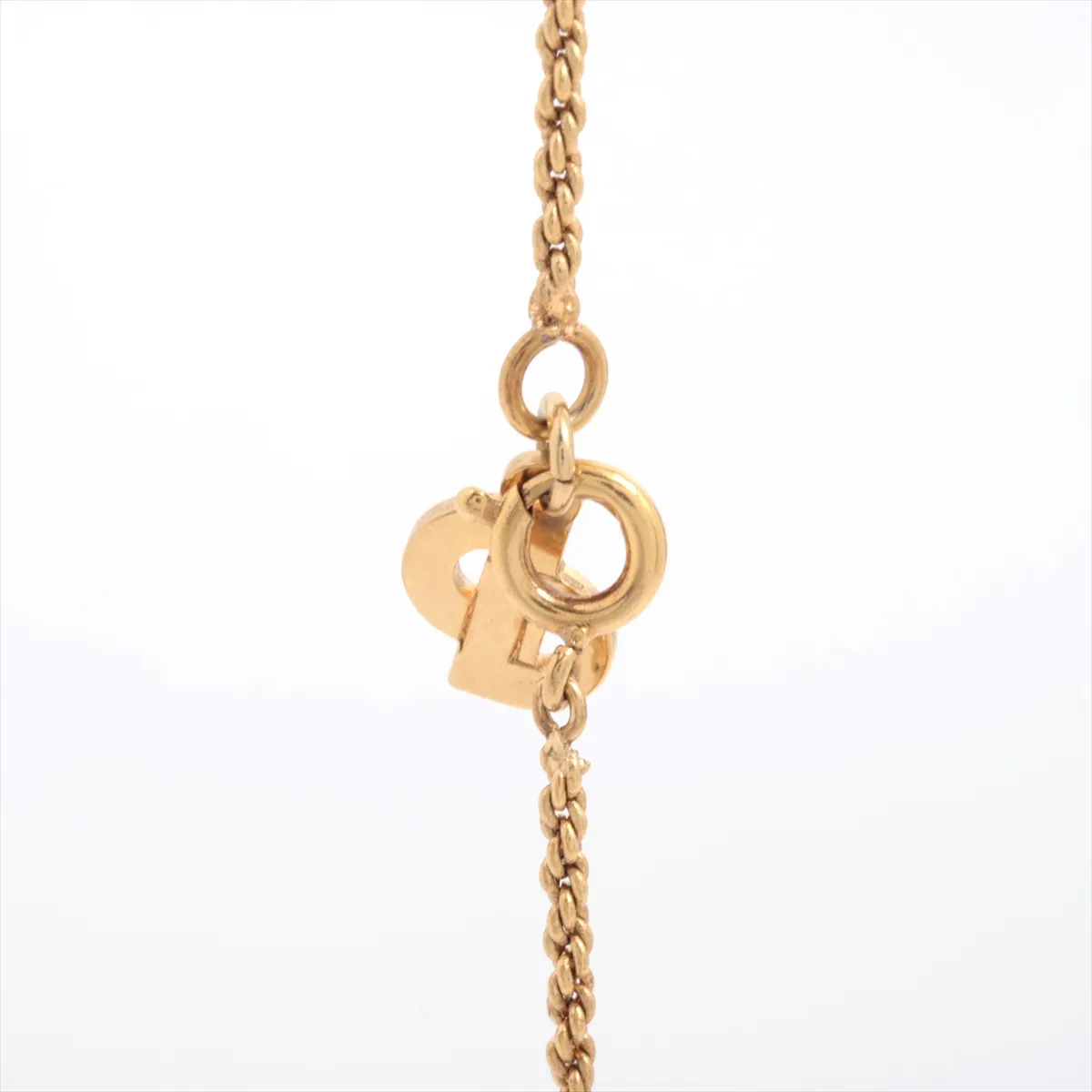 CD logo necklace, gold plated with rhinestones. Shows signs of wear, tarnishing, — view 3