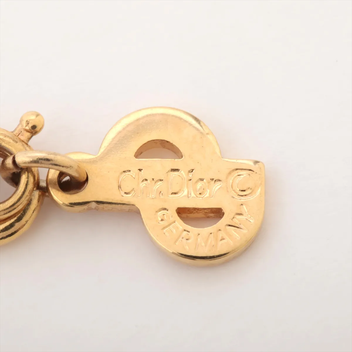 CD logo necklace, gold plated with rhinestones. Shows signs of wear, tarnishing, — view 4