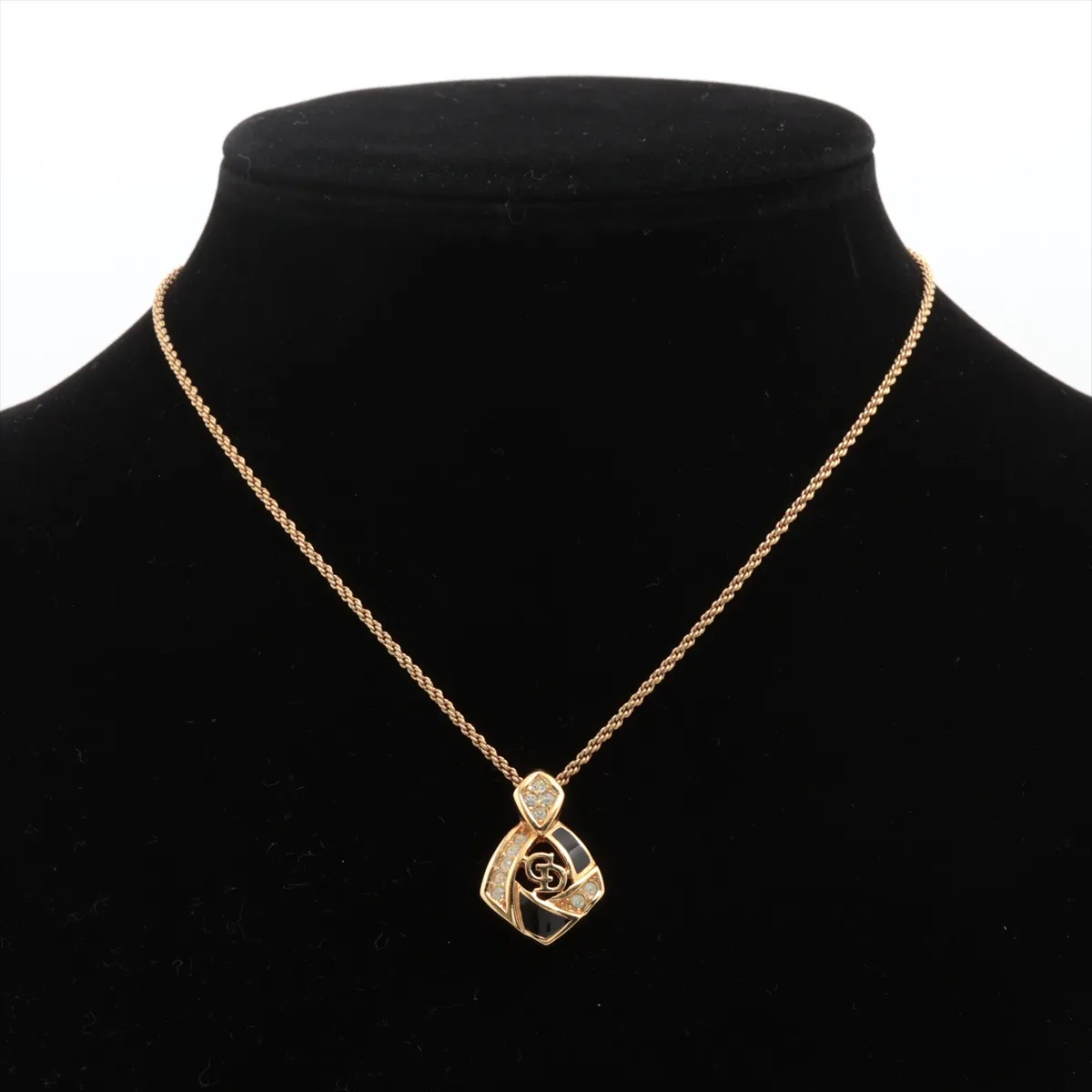 CD logo necklace, gold plated with rhinestones. Shows signs of wear, tarnishing, — view 5