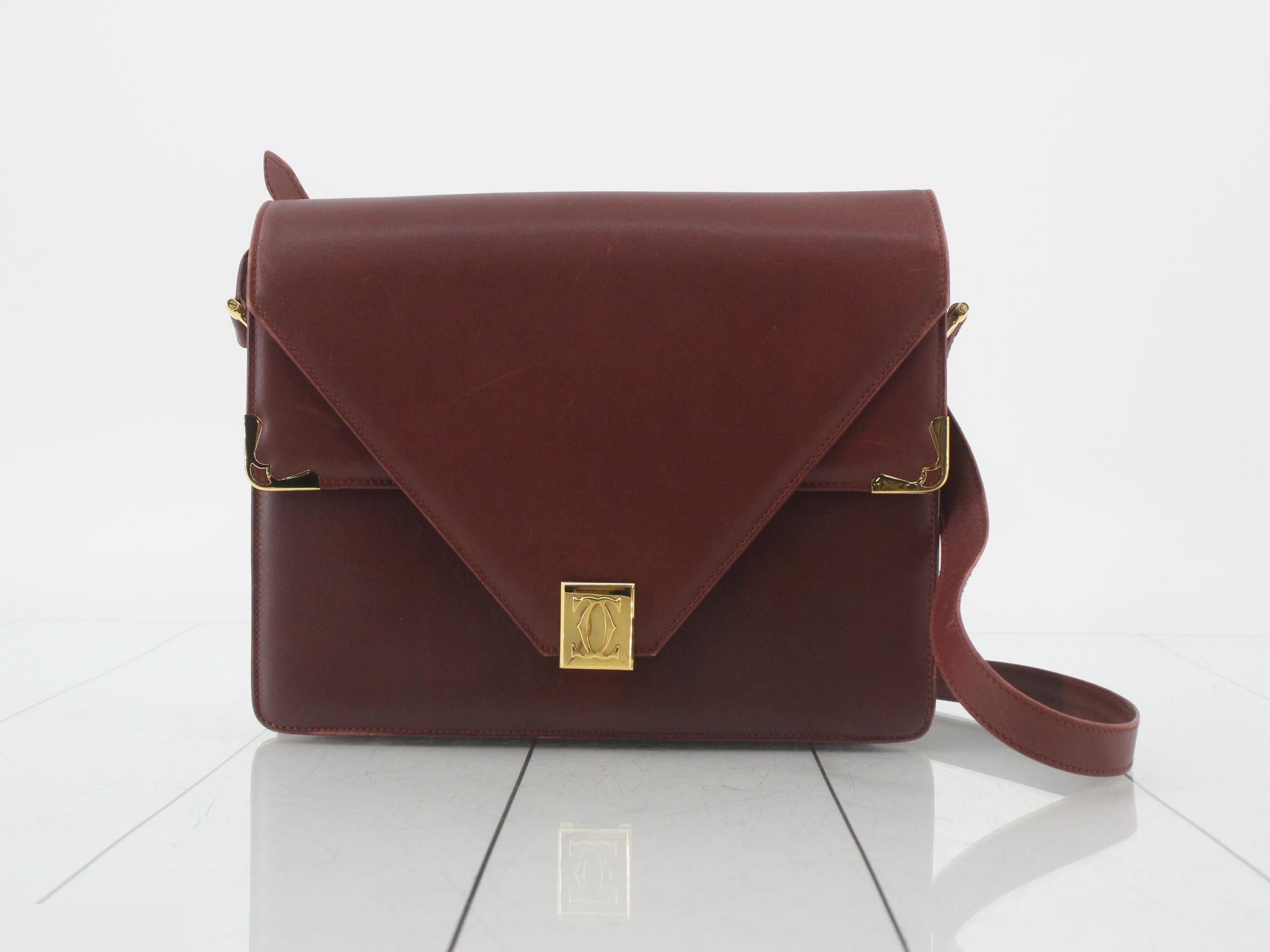 Leather shoulder bag with logo hardware