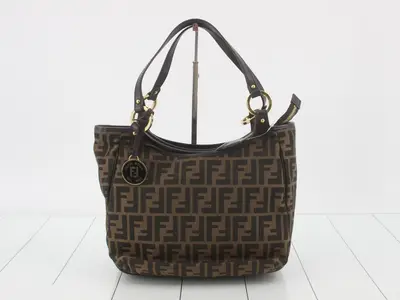 Zucca (bag) tote bag with gold hardware.