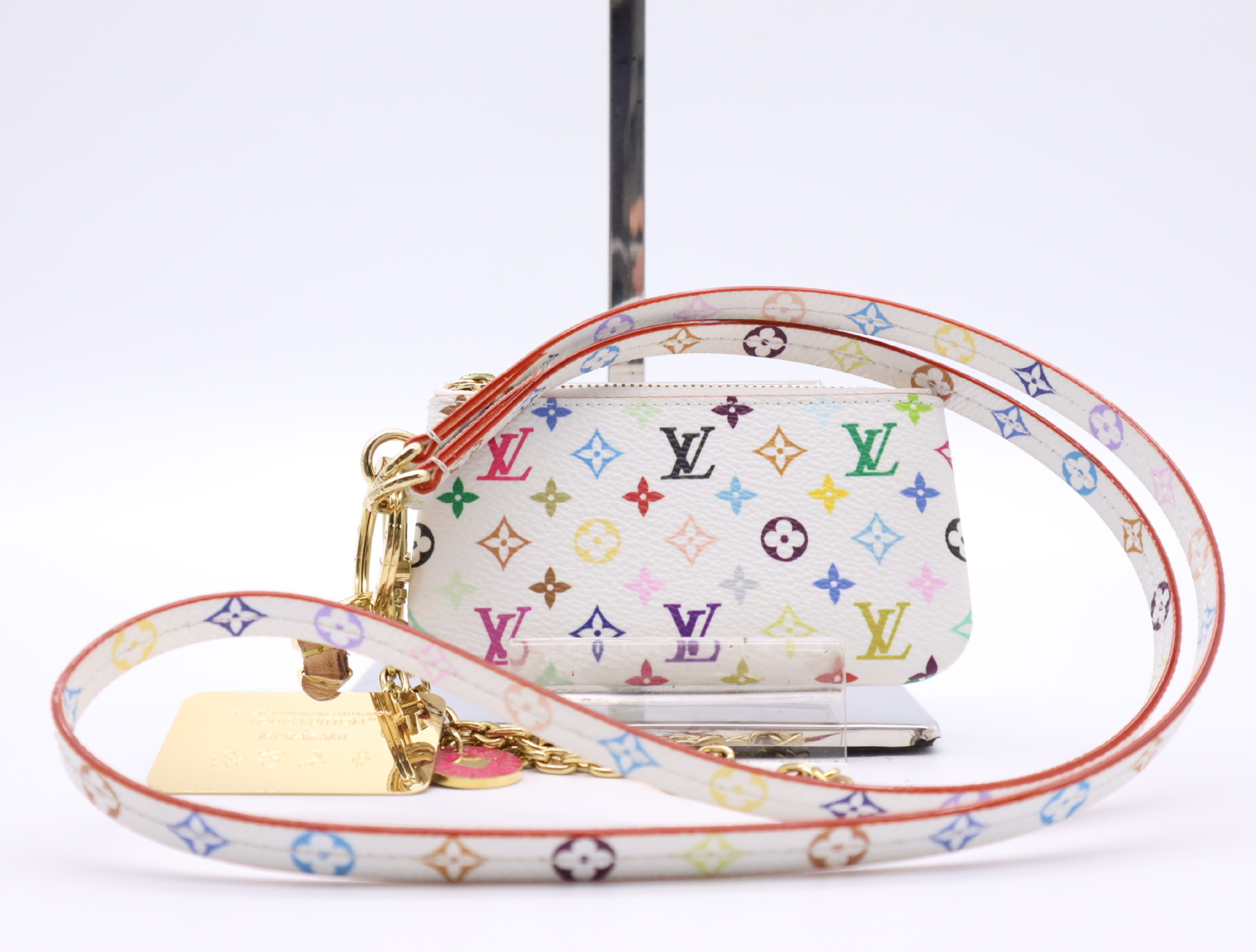 M14099 Multicolor LV x TM Phone Holder Blanc with Strap, Chain Strap, and Charm. Other accessories.