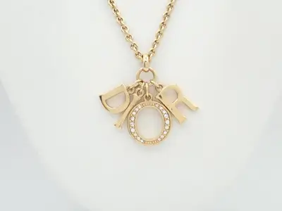Gold necklace with stone, chain approximately 50cm long.