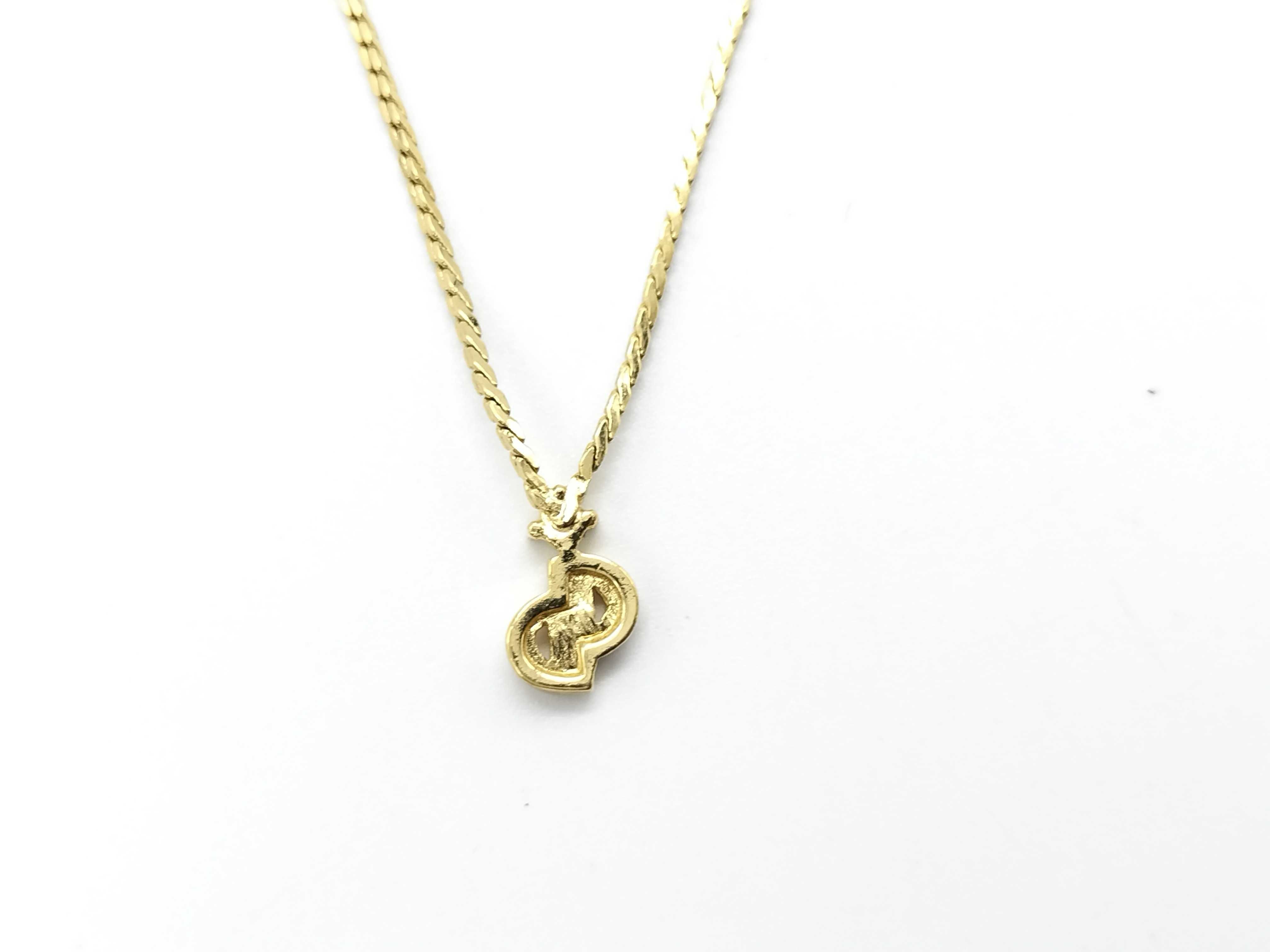 gold-colored necklace with CD logo and gemstone. — view 3