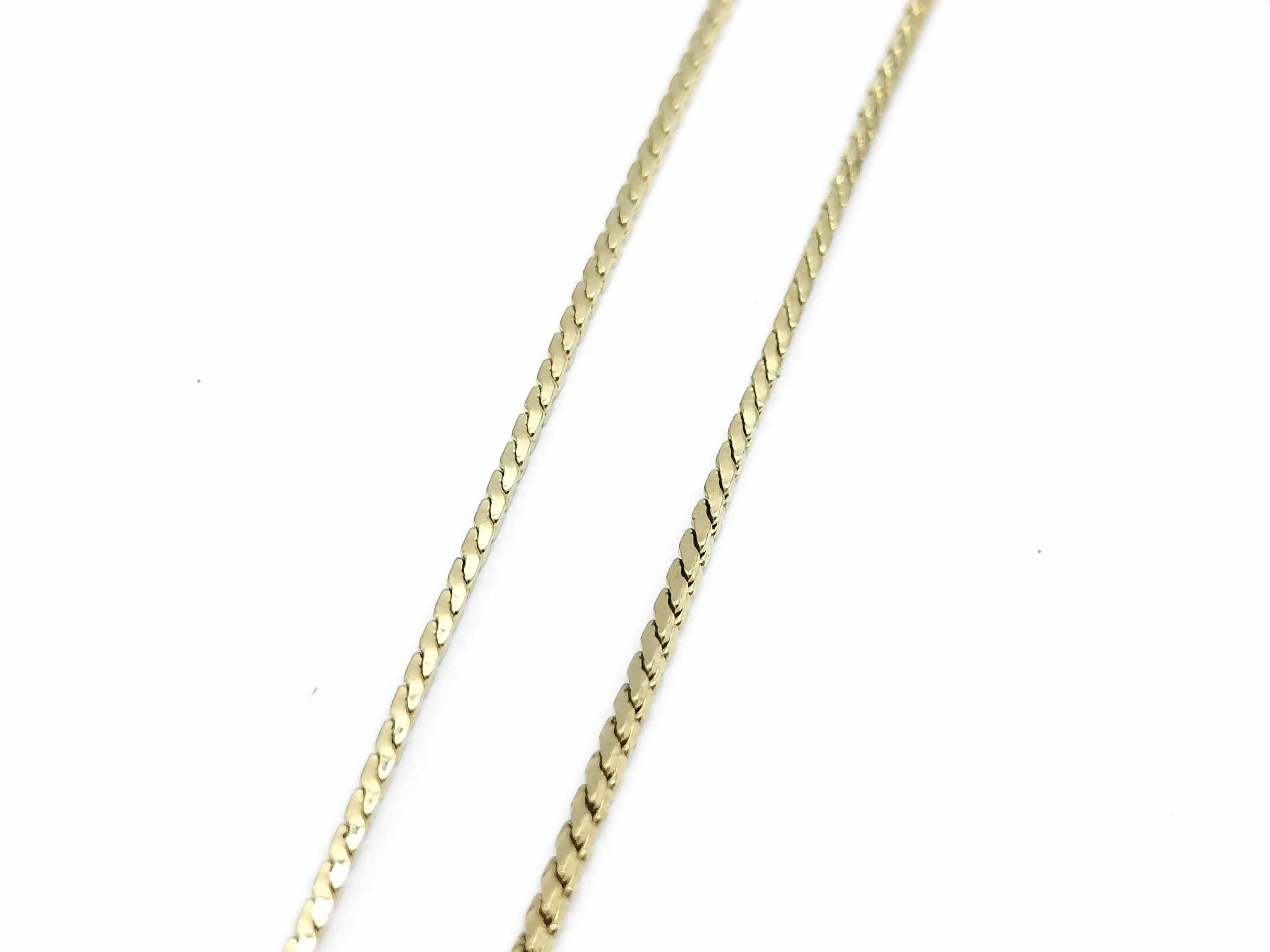 gold-colored necklace with CD logo and gemstone. — view 6