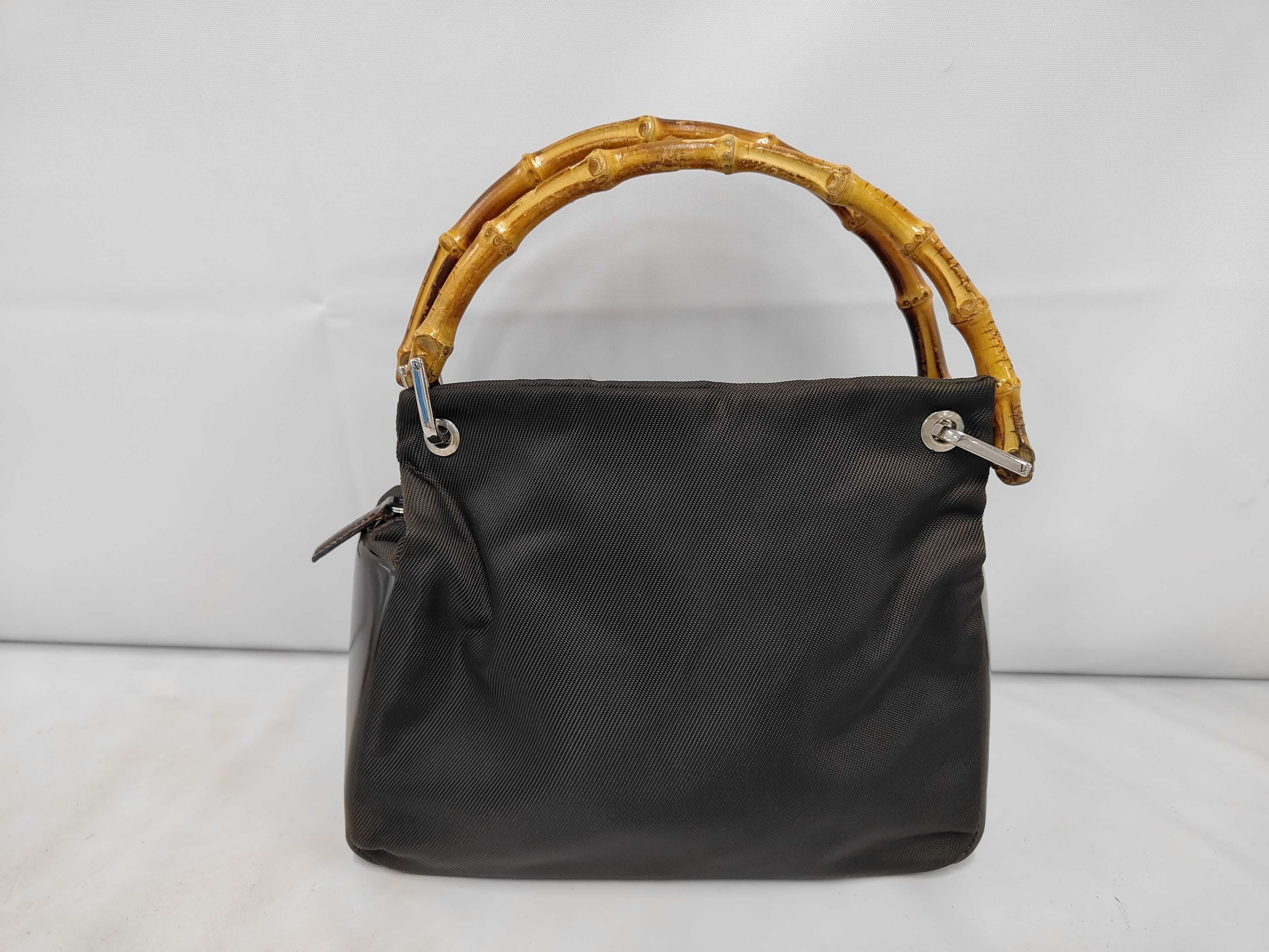 bag with brown bamboo handles.