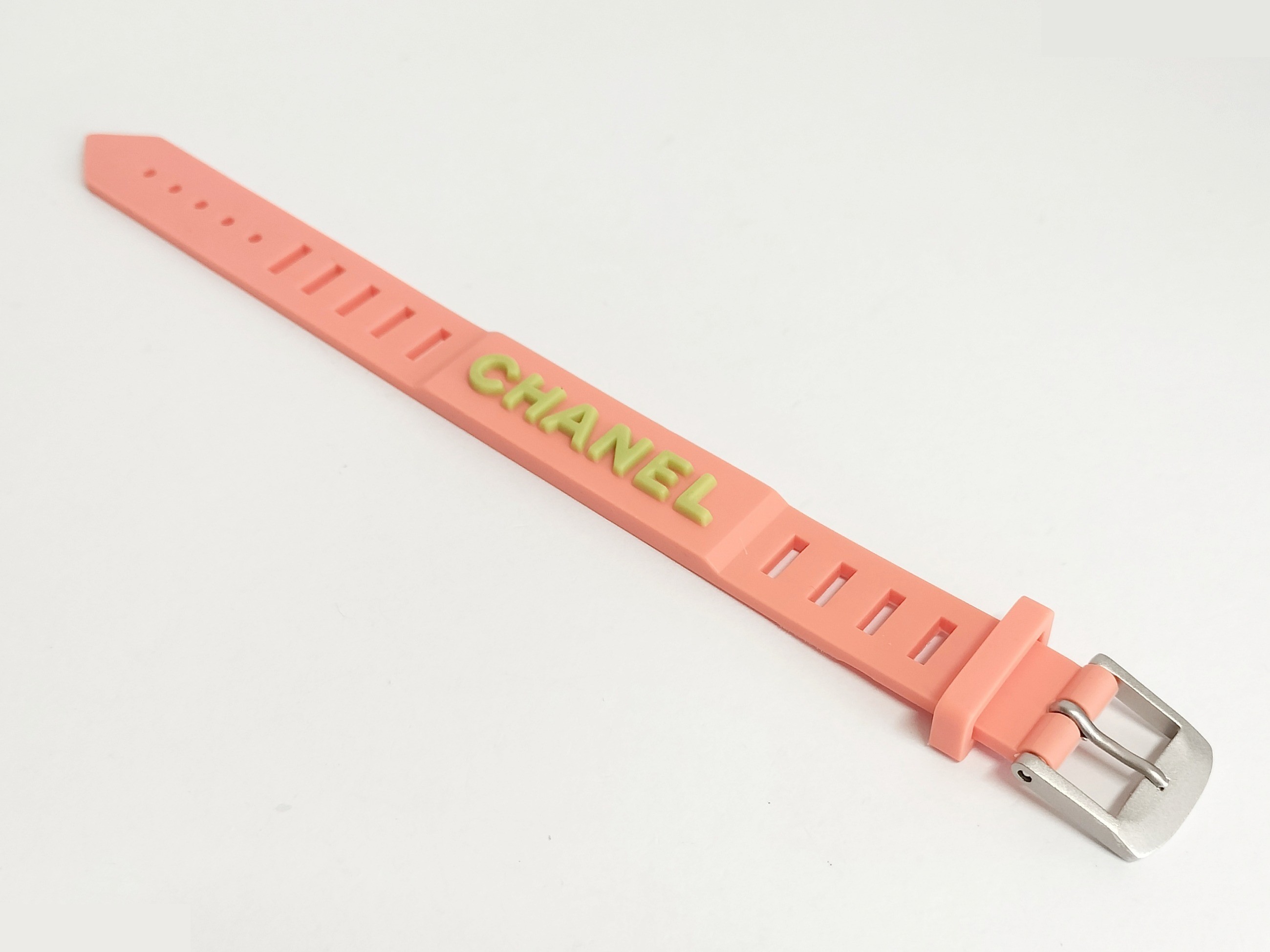 Logo rubber bracelet, orange, approximately 21.5 cm in length.