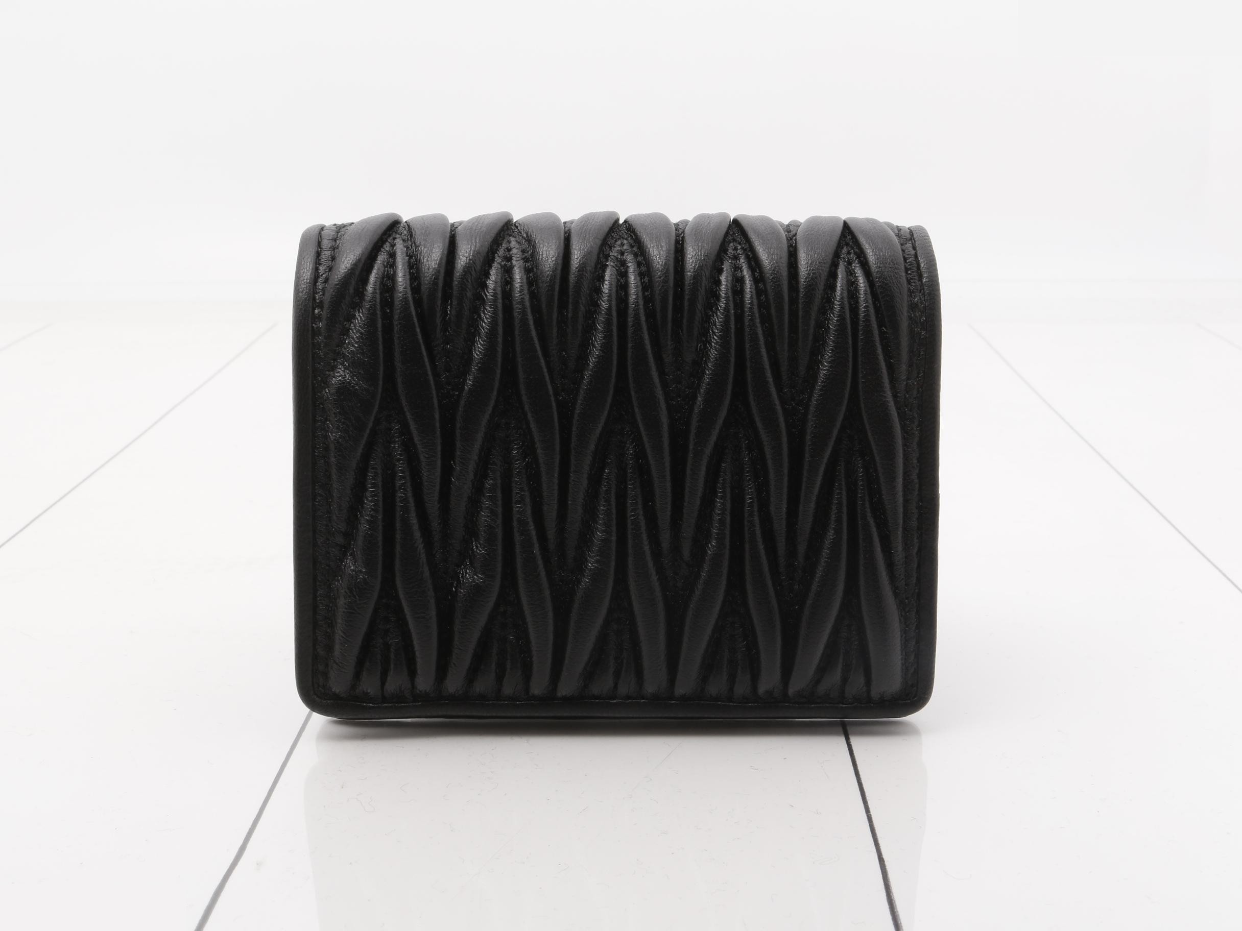 Unused Matelassé leather bi-fold wallet with logo, black. — view 2