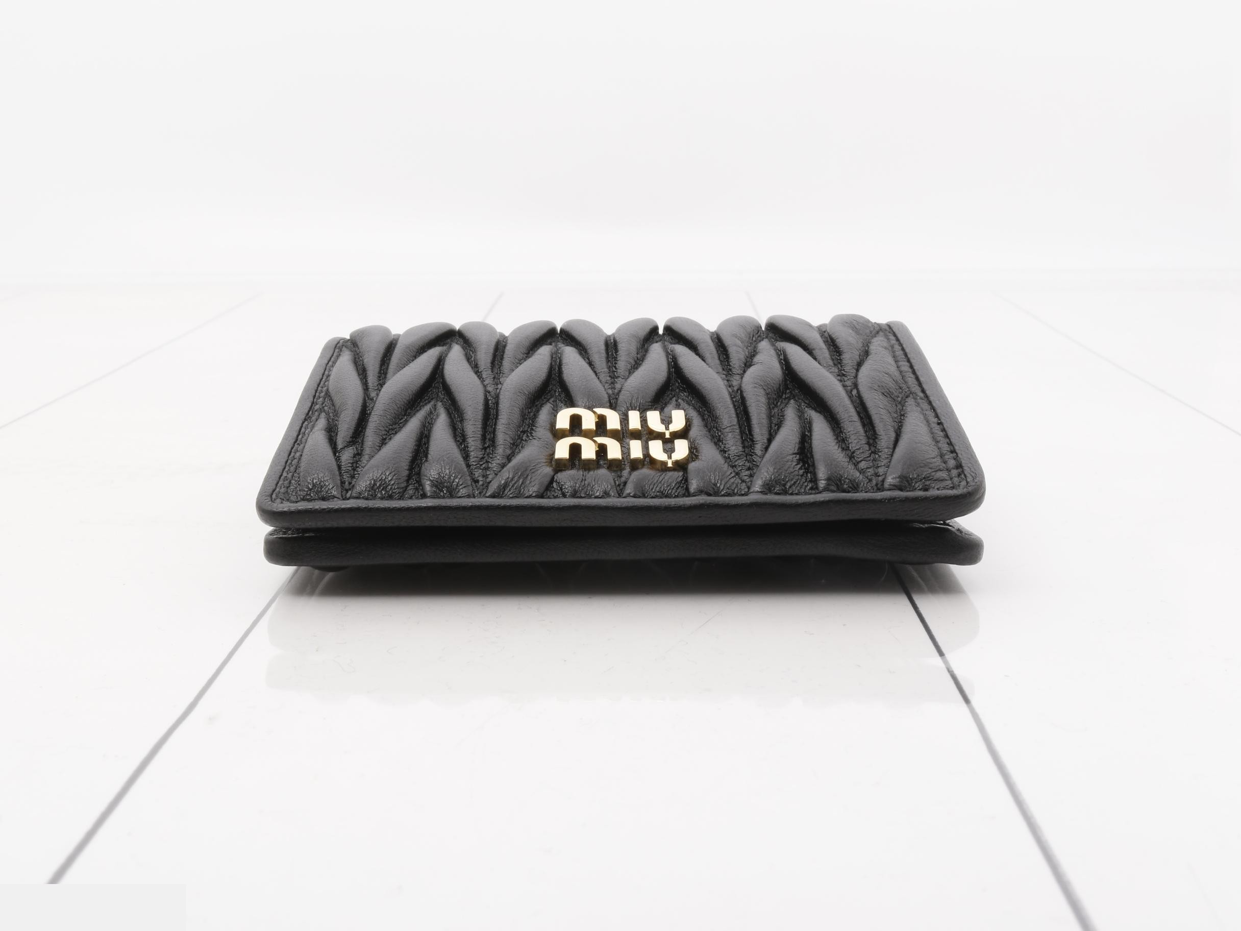 Unused Matelassé leather bi-fold wallet with logo, black. — view 3