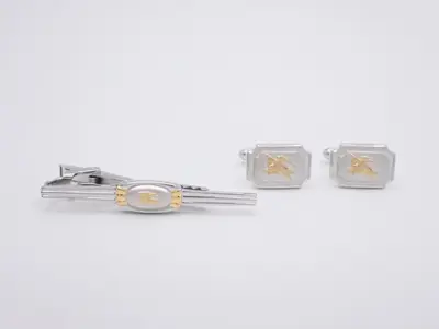 Cufflinks, tie clips, and case.