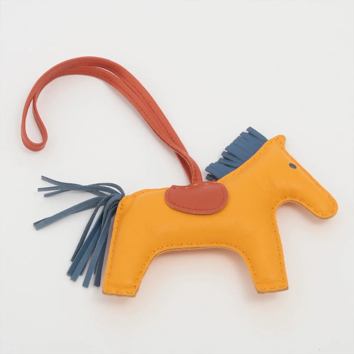 Rodeo Charm MM, charm in Agneau Milo mustard color, shows signs of wear, — view 2
