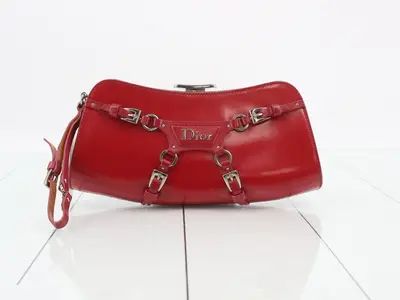 Other lines: Bags, clutches, pochettes, bondage style clutch, red