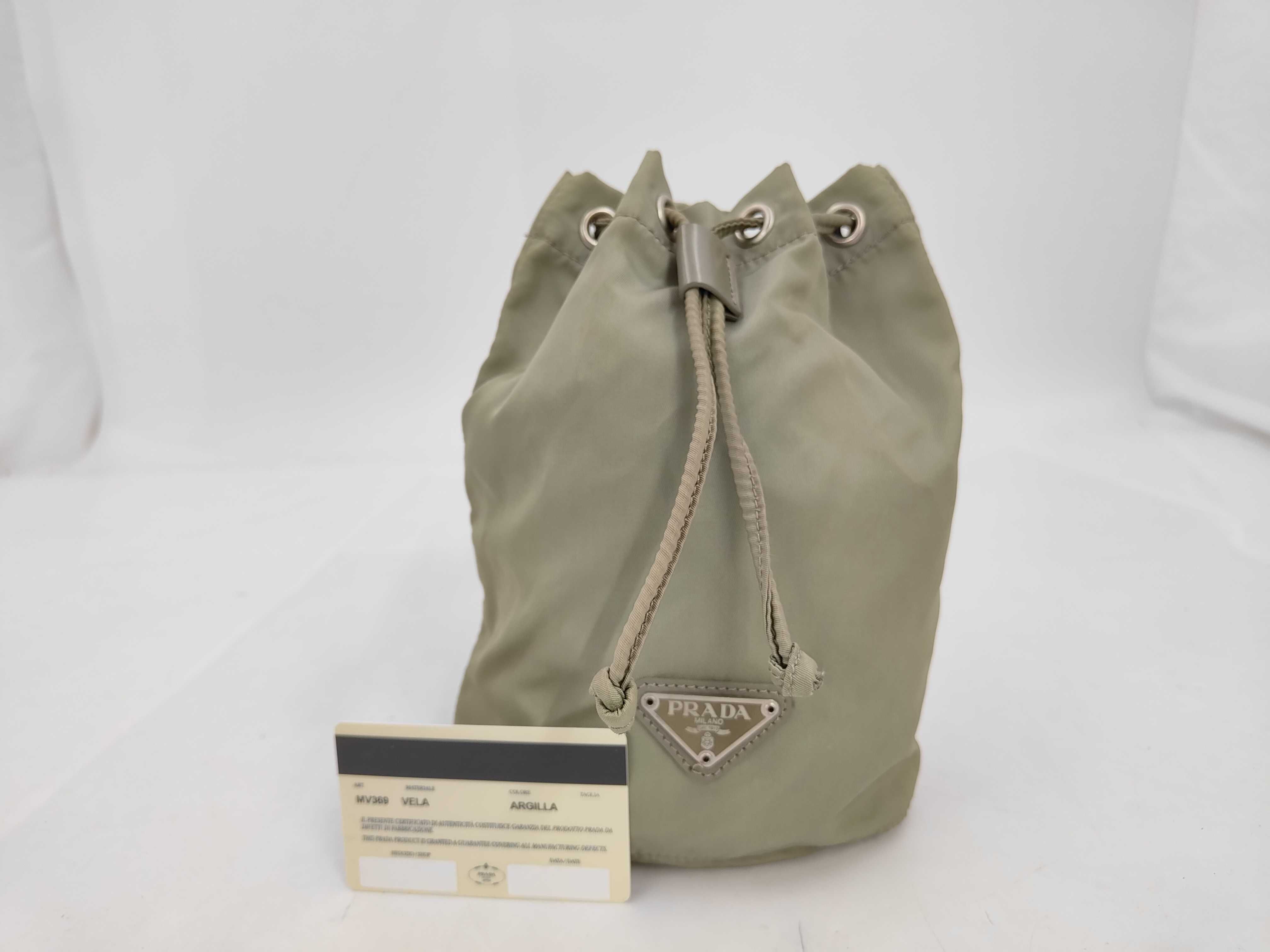 nylon drawstring pouch with triangular logo. (Nylon handbag/pouch)